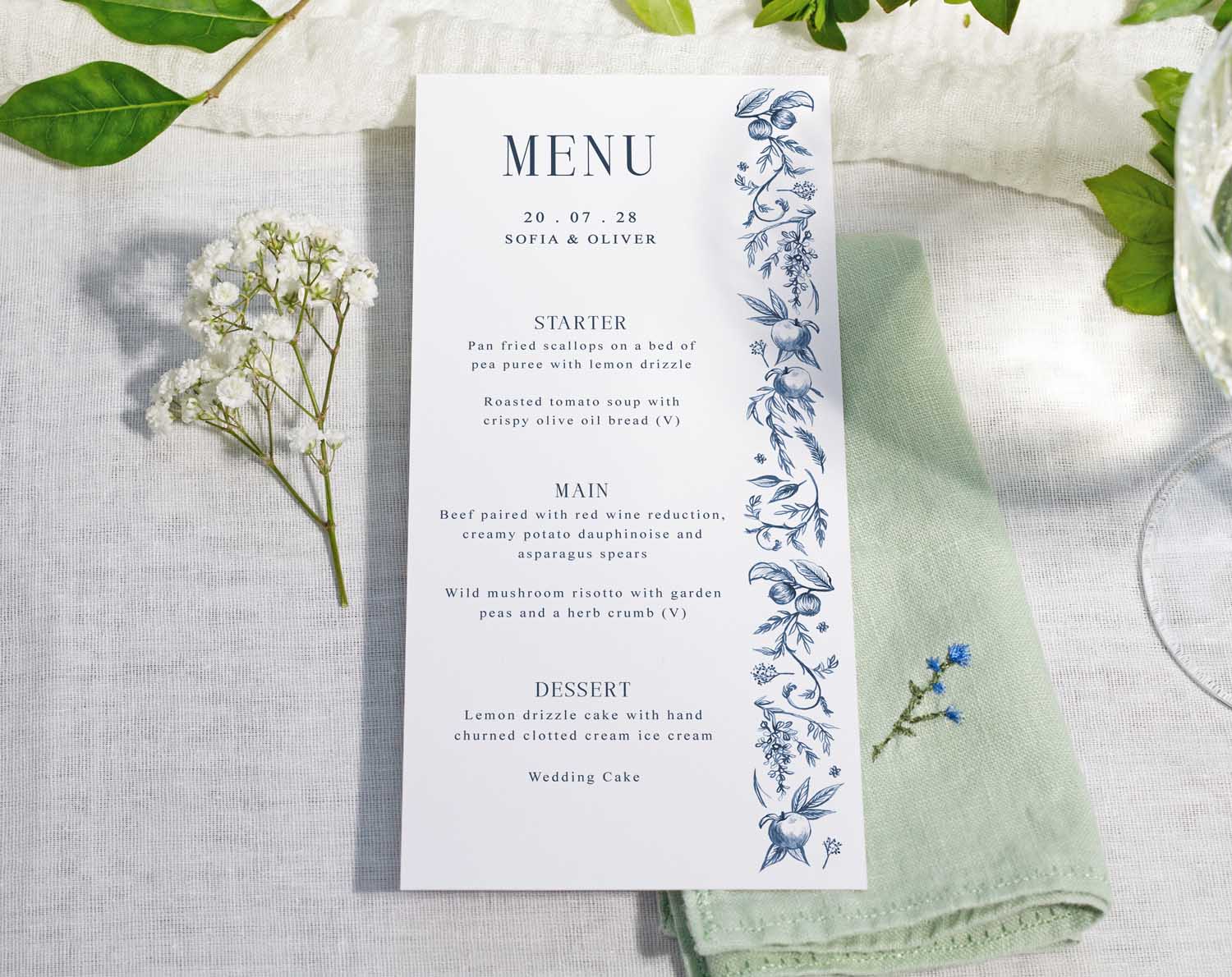 Blue Garden Wedding Menus featuring floral design on a wedding table setting.