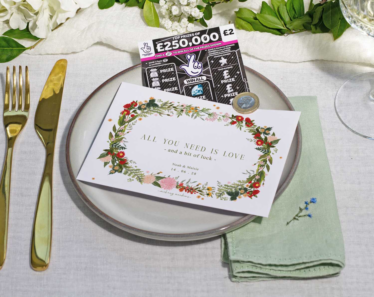 Boho Scratch Card Envelopes on a dinner plate, featuring floral design and scratch card for wedding favours.