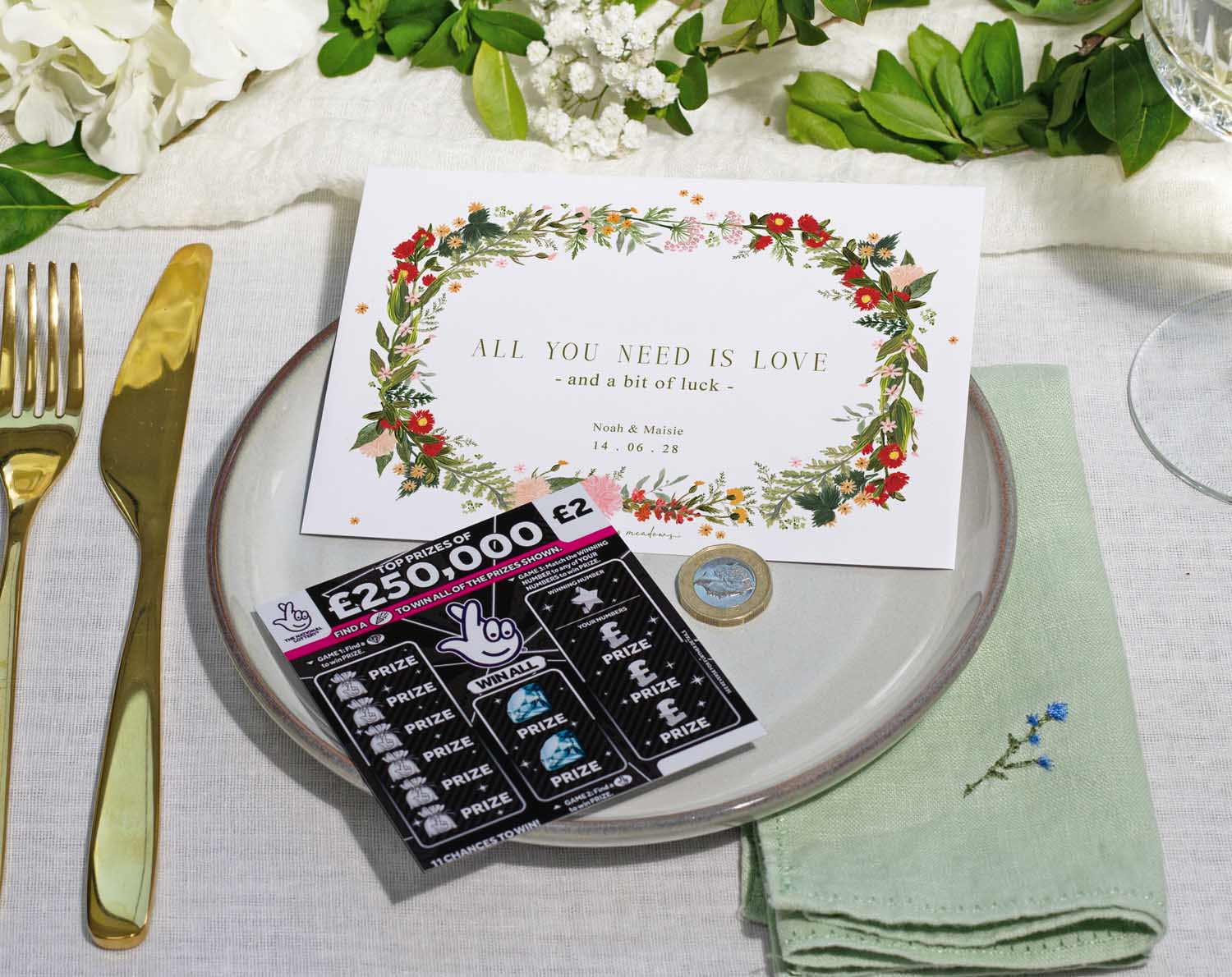 Boho Scratch Card Envelopes displayed on a wedding table setting with floral accents and a scratch card.