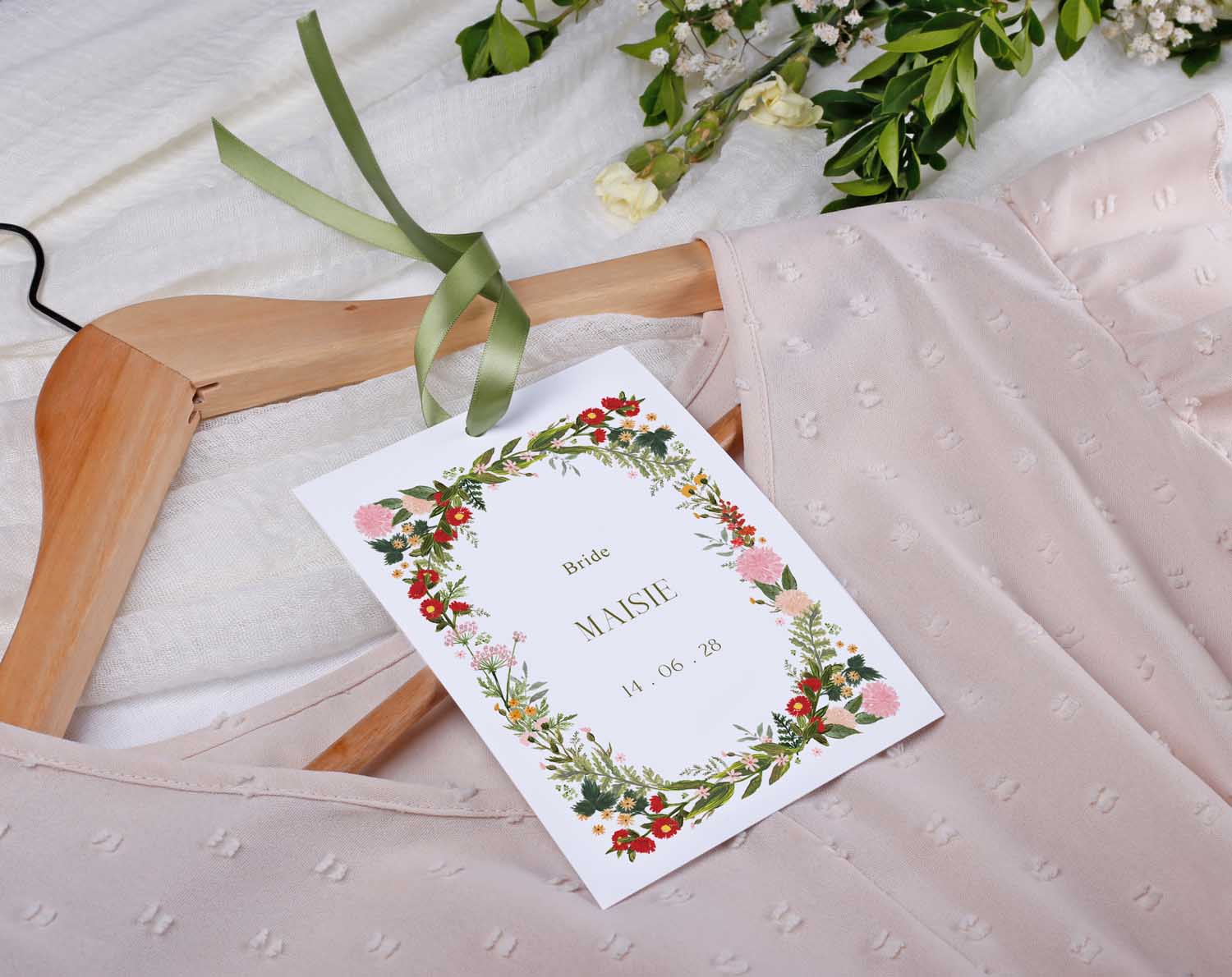Boho Wedding Hanger Tags for bridal party with floral design and personalized name tag on wooden hanger.