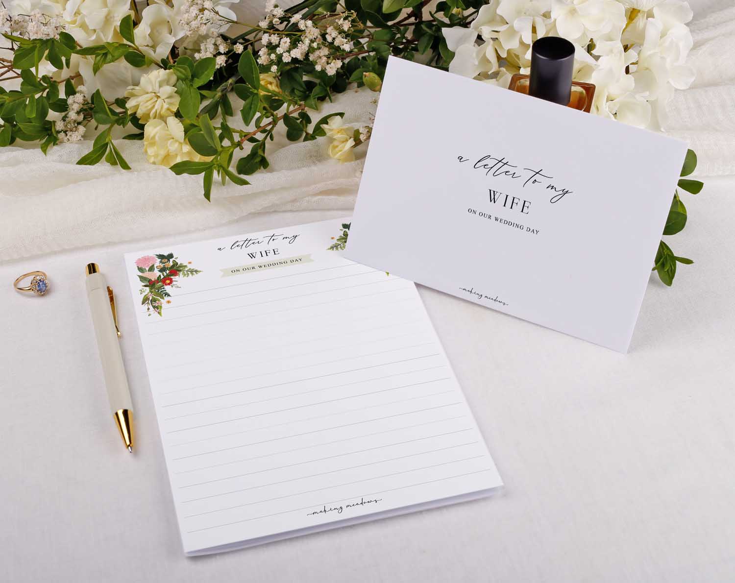 Boho Wedding Letter to My Wife on a beautiful stationery with floral design and a pen.