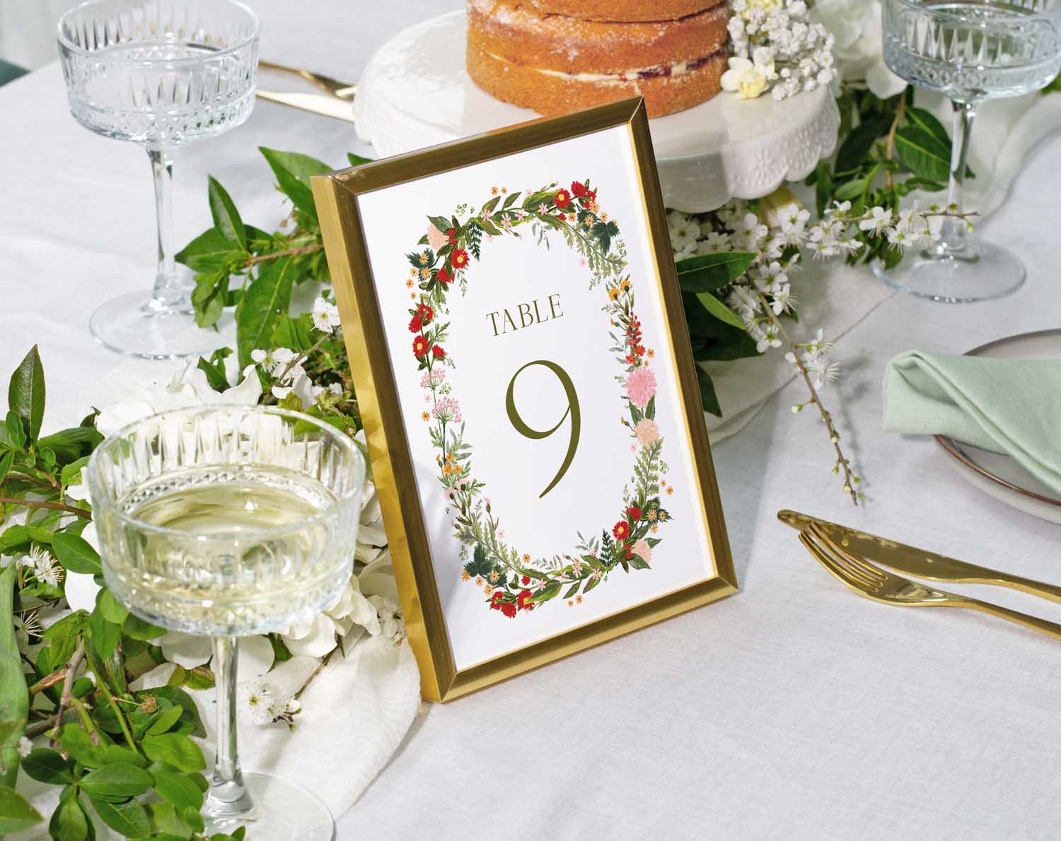Boho Wedding Table Numbers with floral design displaying Table 9 at an elegant wedding reception.