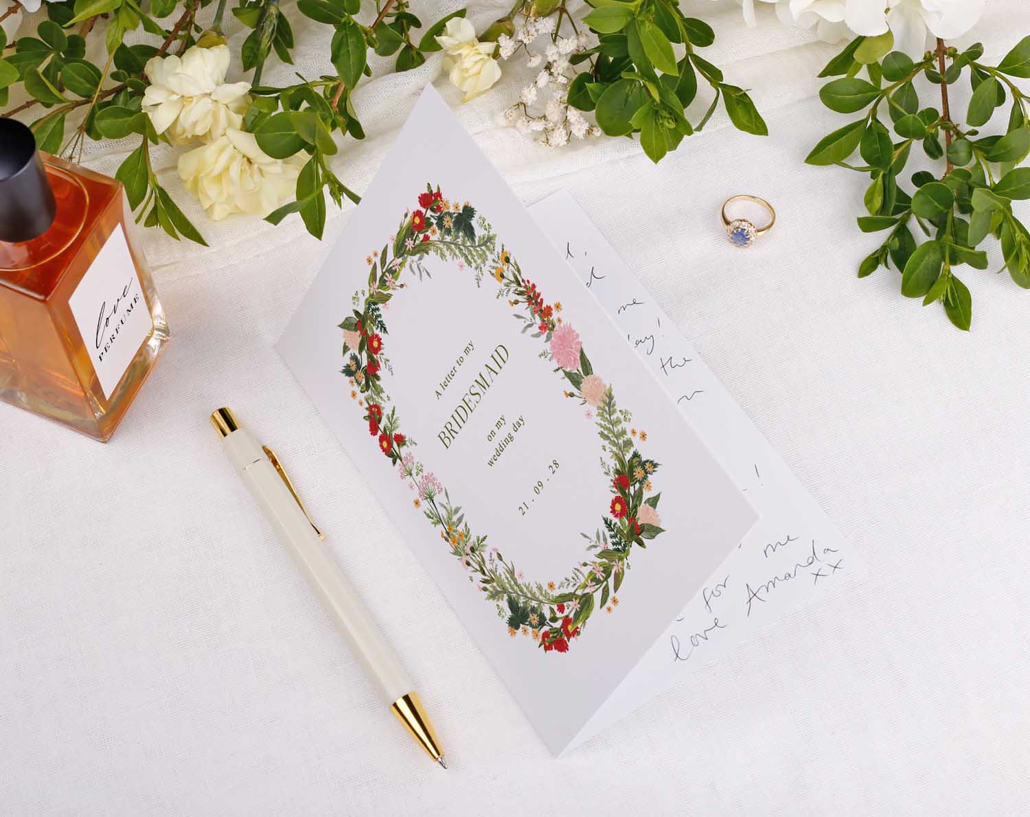 Boho Wedding Thank You Card displayed on a table with flowers, a pen, and a ring for bridal party.