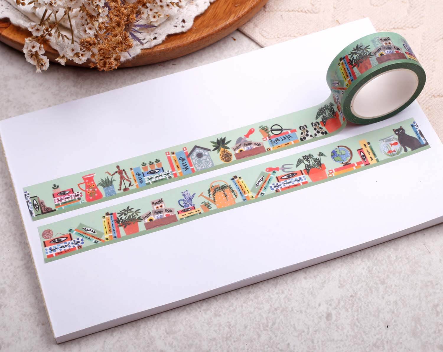 Book Washi Tape - Eco Paper Roll featuring colorful literary motifs on a green background, perfect for crafting.