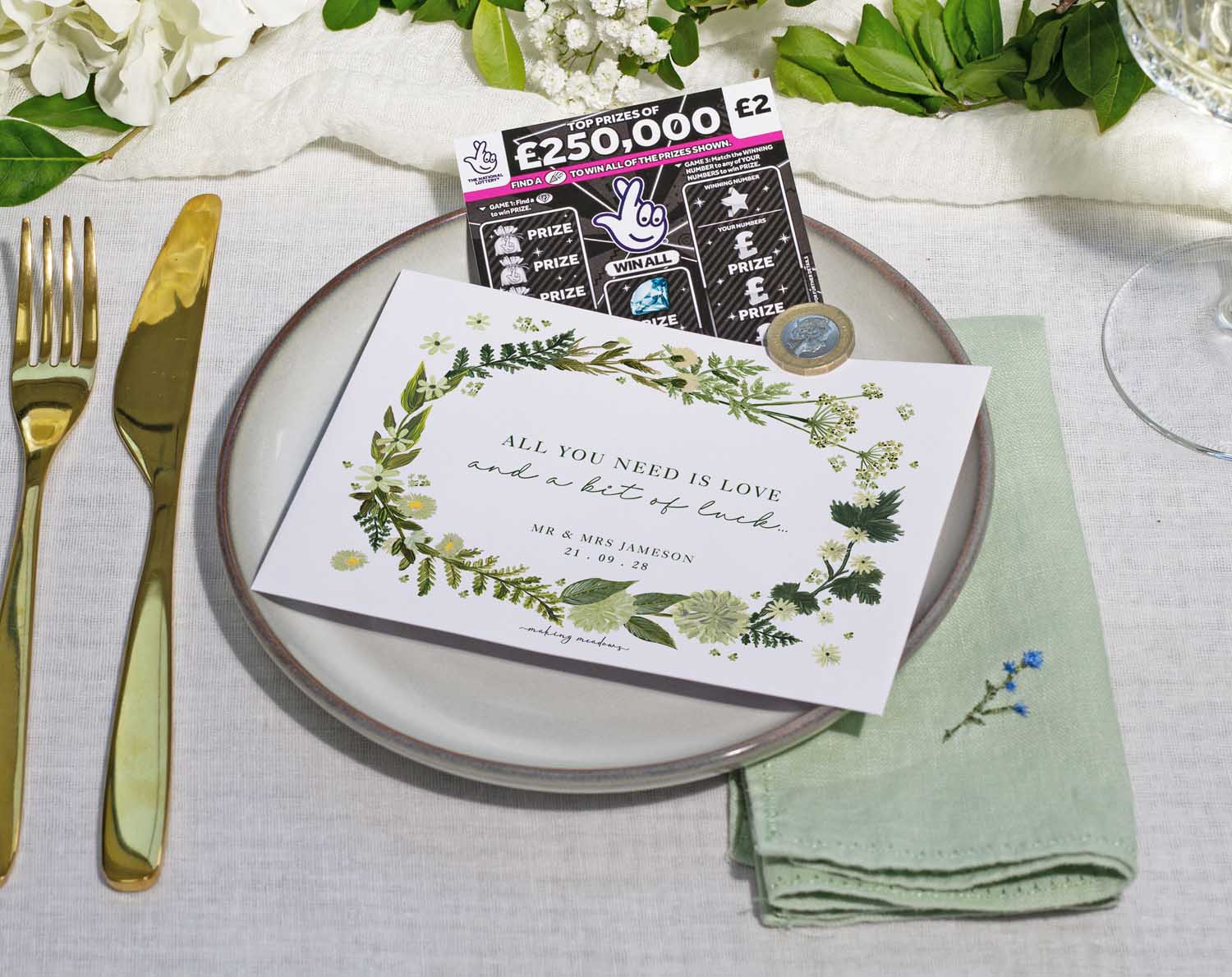 Botanical Scratch Card Envelopes on a wedding dinner plate with a scratch card and personalized message.