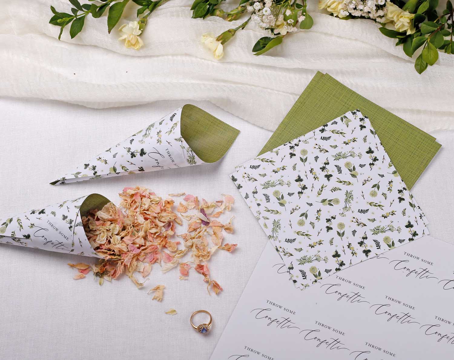 Botanical Wedding Confetti Cones with dried petals and personalized labels on a decorative table setting.