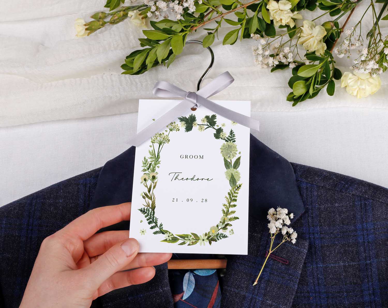 Botanical Wedding Hanger Tags featuring groom tag with greenery and ribbon for wedding preparation photos.