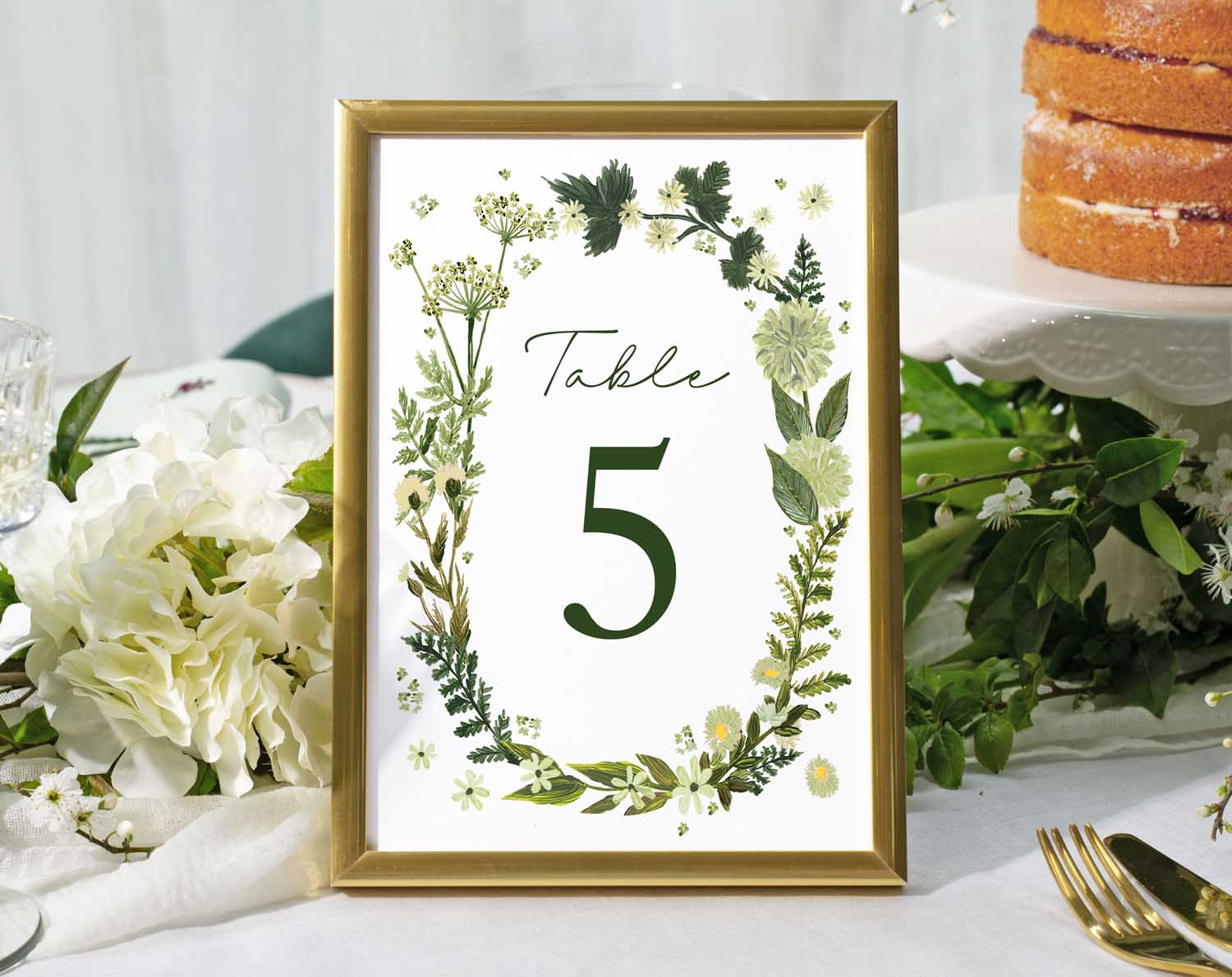 Botanical Wedding Table Numbers featuring table 5 in a floral frame on a reception table setting.