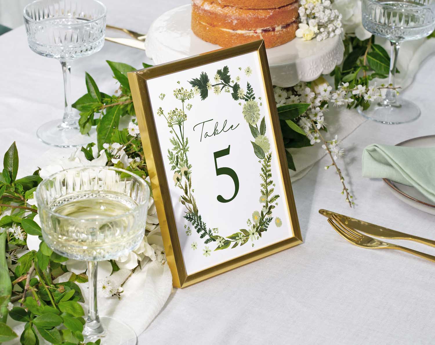 Botanical Wedding Table Numbers featuring a leafy design with the number 5 on a elegantly styled table setting.
