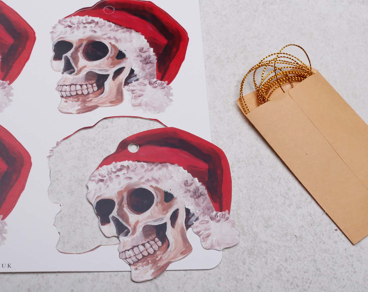 Gothic Skull Christmas Gift Tags with Santa hats, perfect for unique Nutcracker Christmas Gift Tags, 12 pack shown.