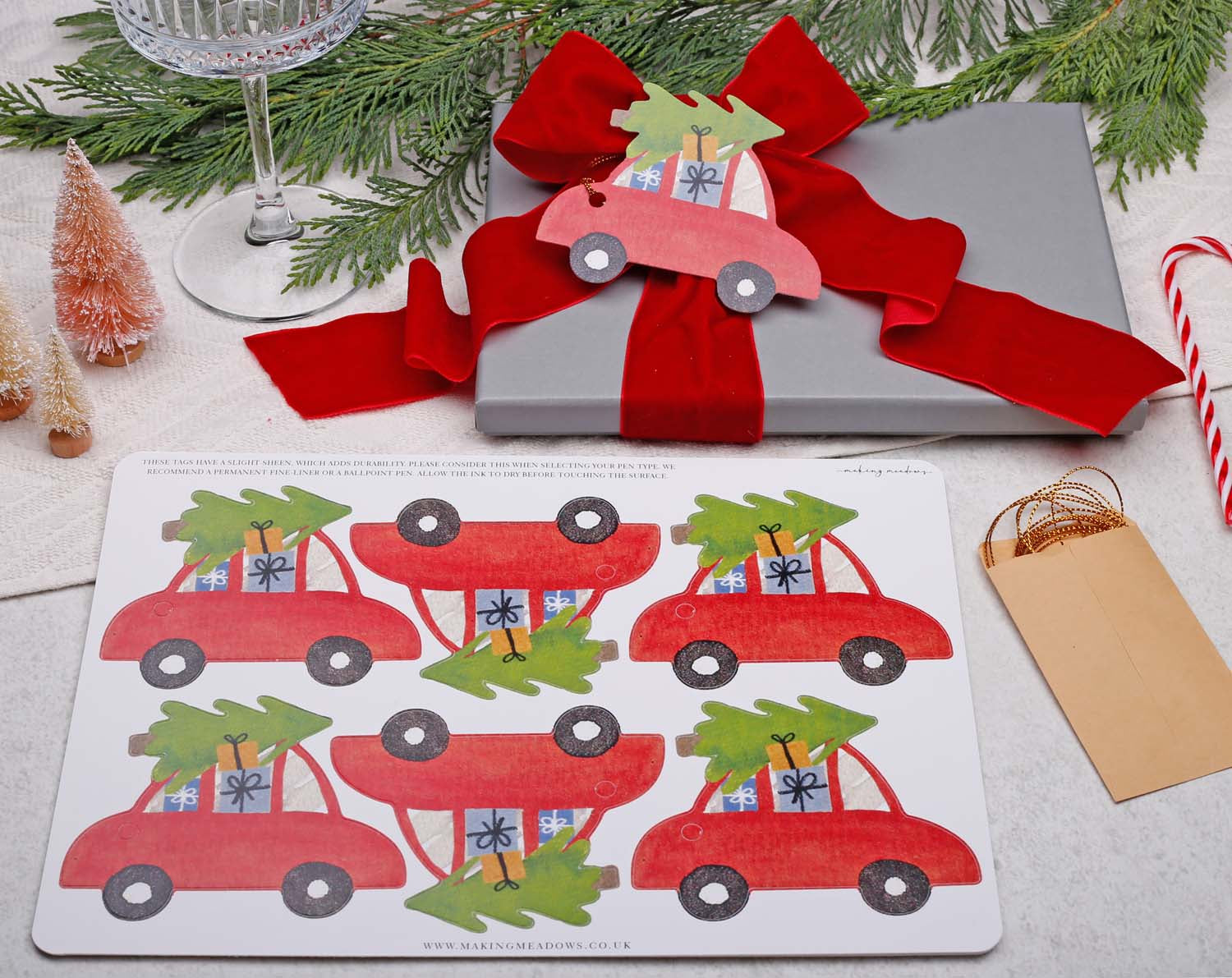 Car Christmas Gift Tags design featuring red cars with Christmas trees on gift wrapping.