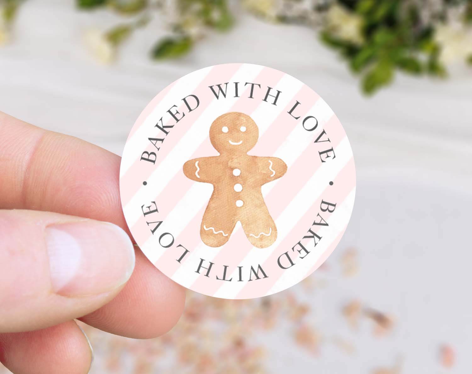 Christmas Gingerbread Baked With Love Stickers featuring a gingerbread cookie design on a pink background.