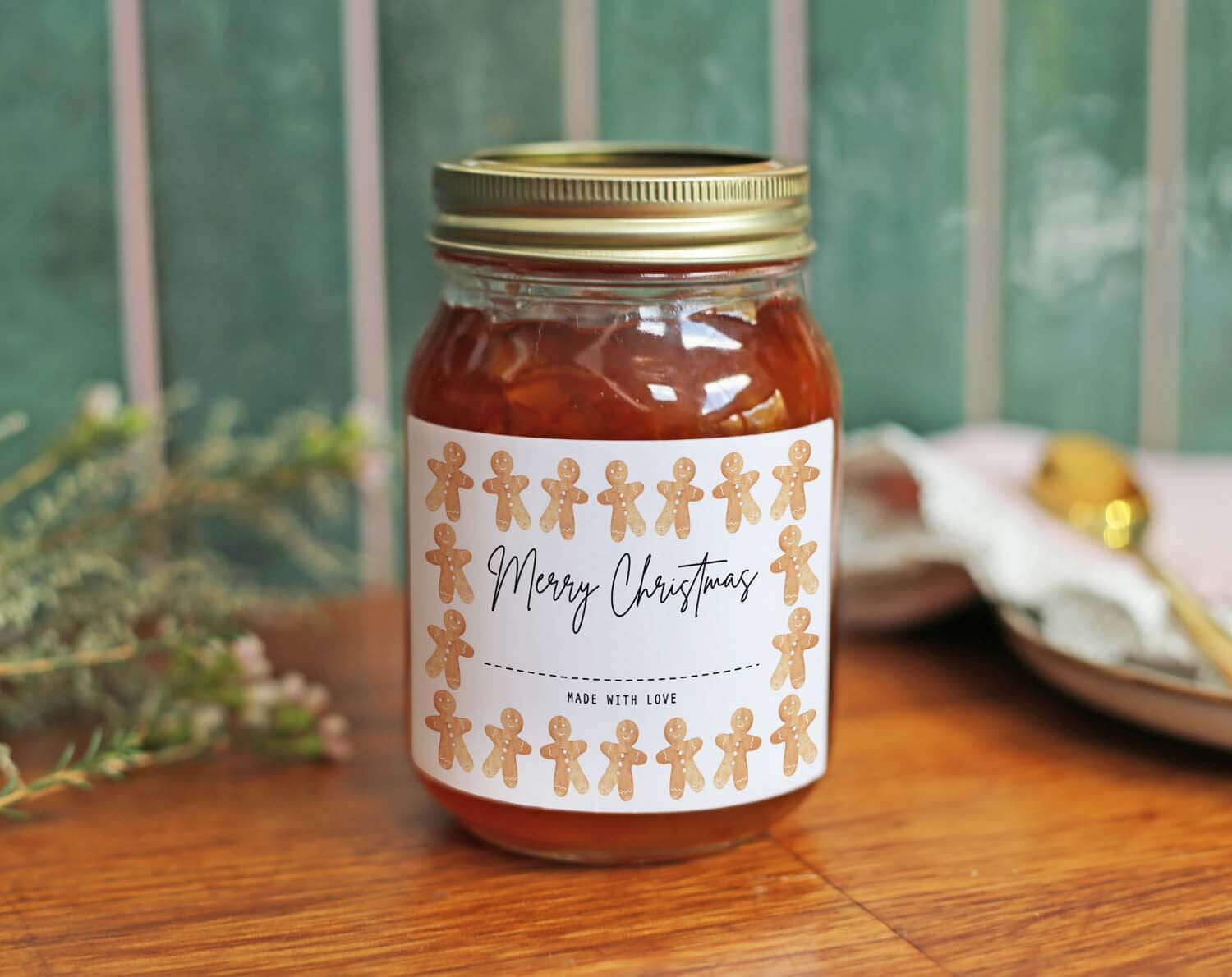 Christmas Jam Jar Labels With Gingerbread Men on a jar with festive design and gold lid in a cozy setting.