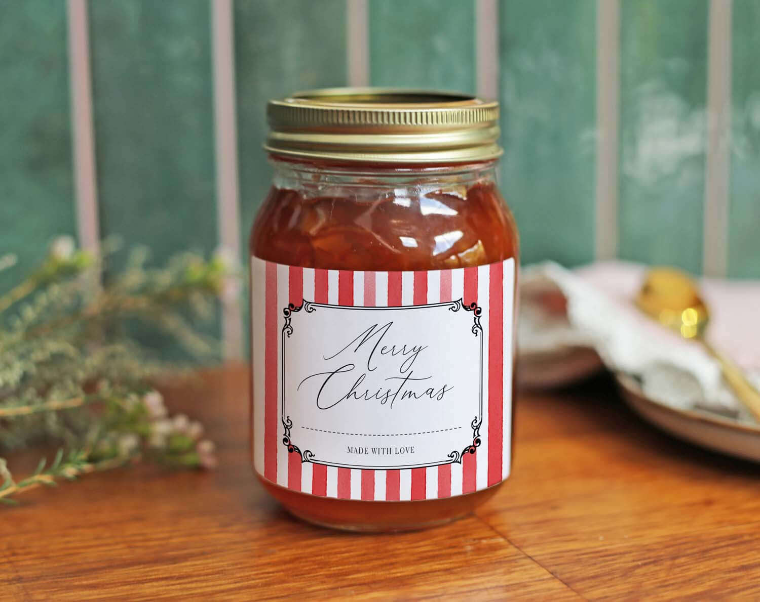 Christmas Jam Jar Labels With Red Stripes on a jar decorated with a gold lid and a festive label.