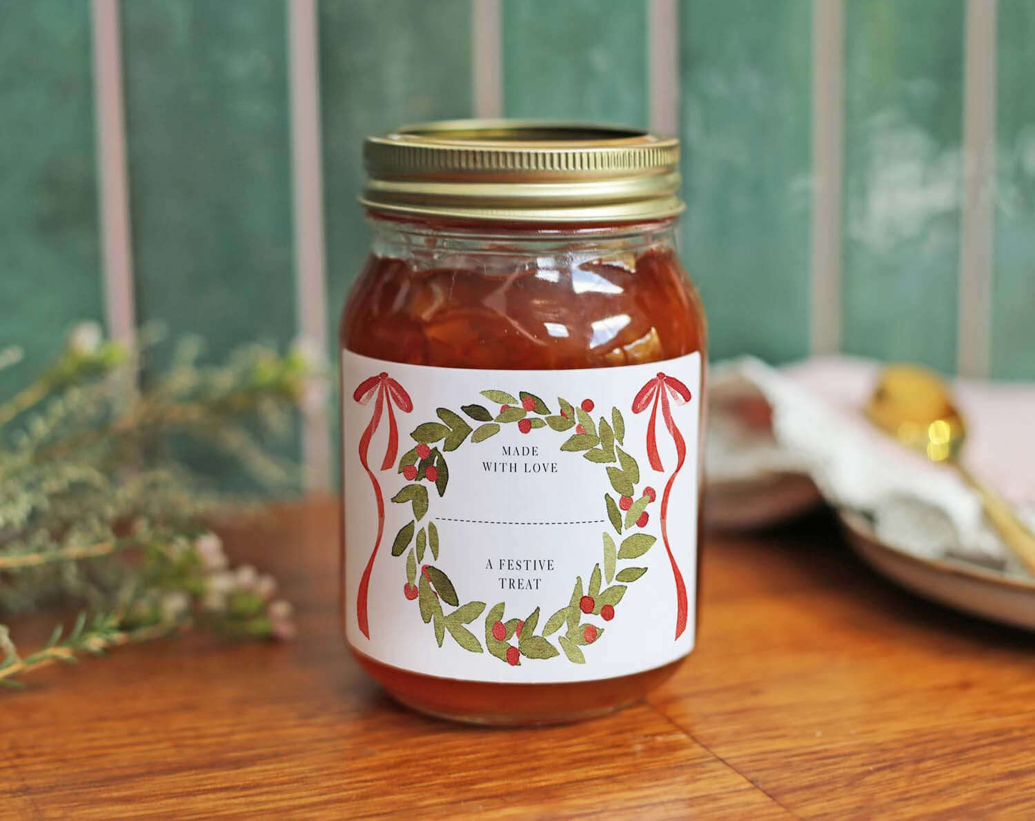 Christmas Jam Jar Labels With Wreath on a jar filled with homemade jam, perfect for holiday gifting.