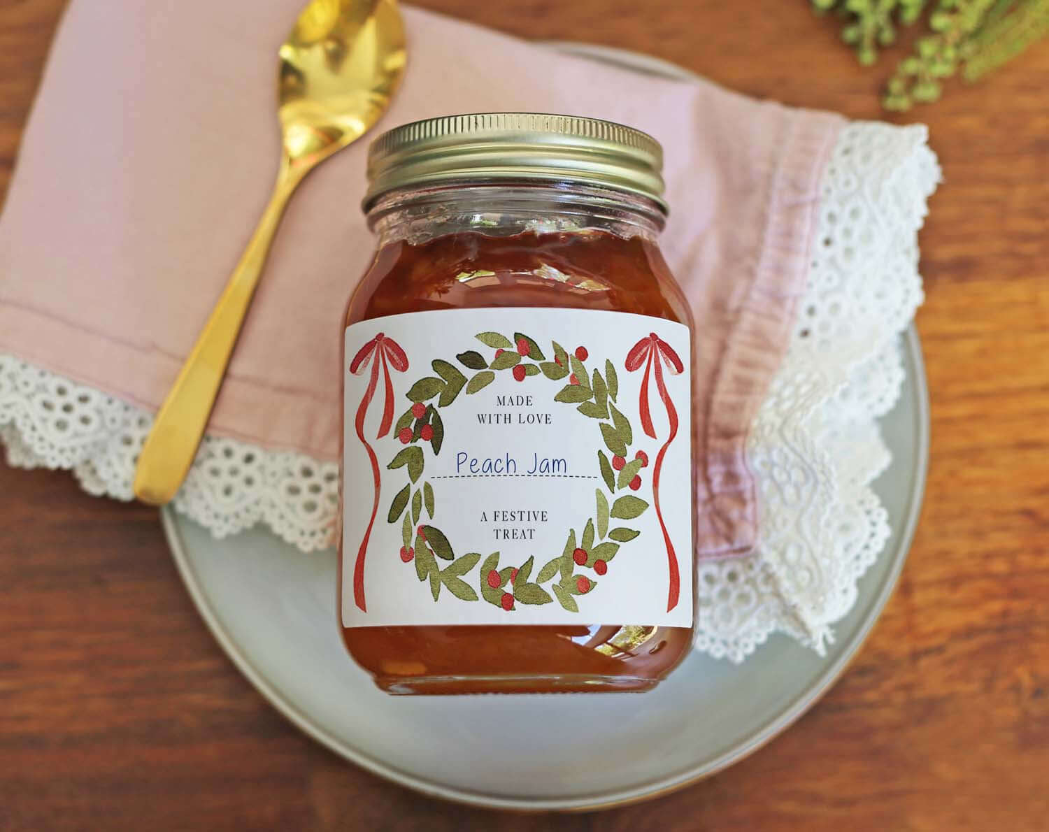 Christmas Jam Jar Labels With Wreath on a jar of Peach Jam with decorative wreath design.