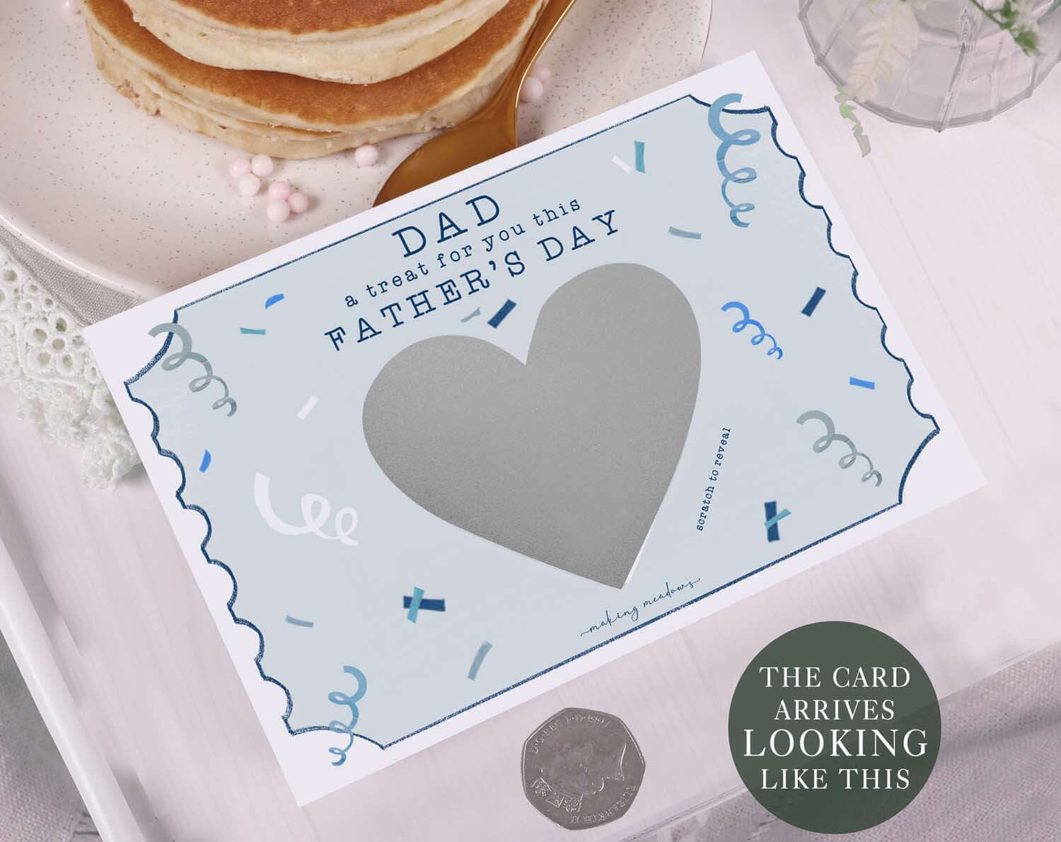 Confetti Scratch To Reveal Card For Dad featuring a grey heart scratch area and blue confetti design for Father's Day.