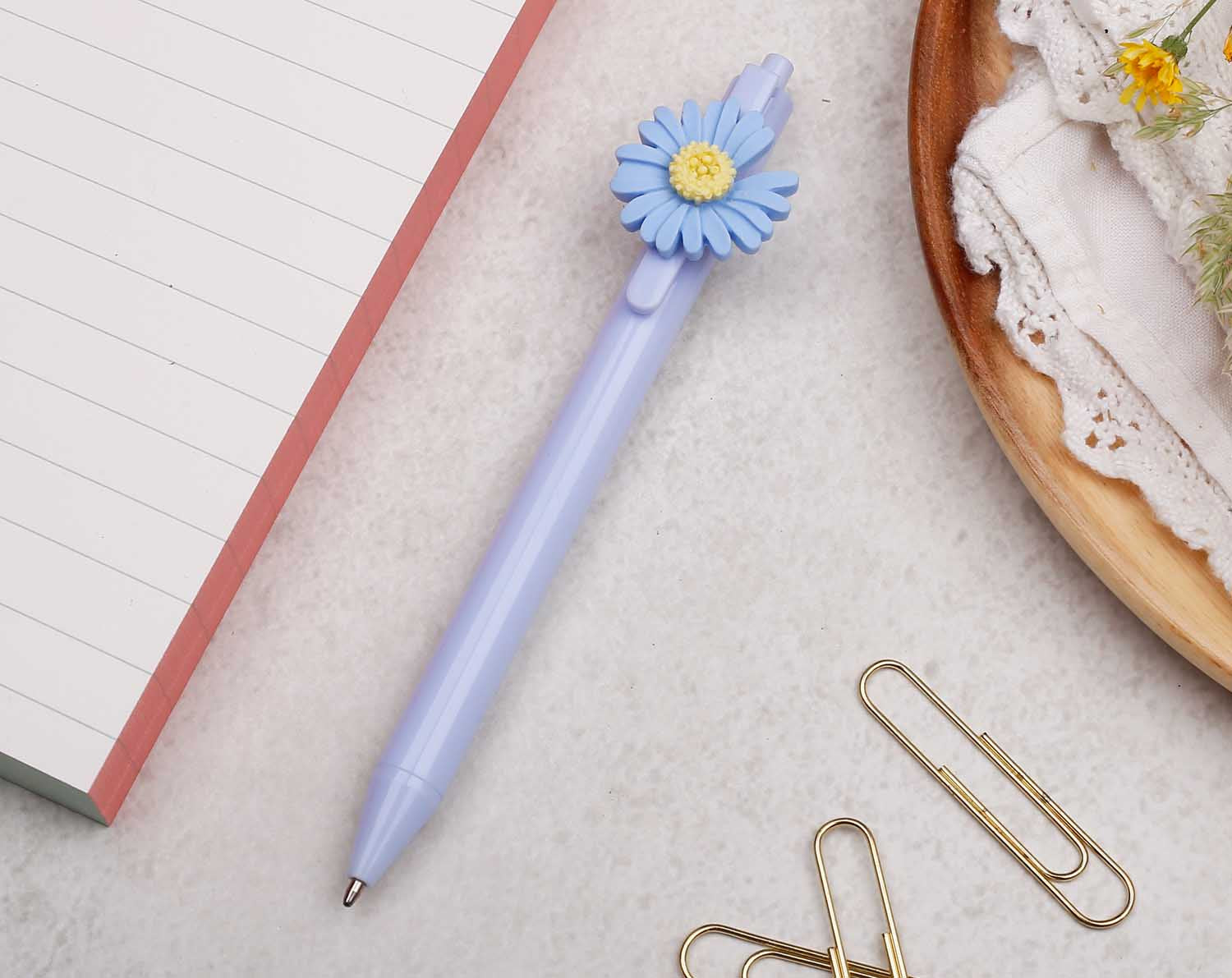 pastel blue pen with ballpoint tip and daisy flower detail