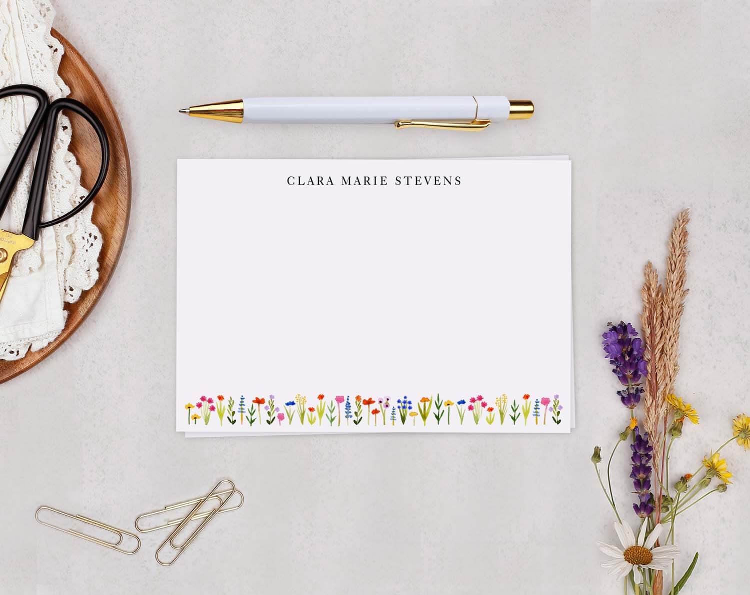 Ditsy Floral Personalised Note cards on a desk with stationery, featuring a charming floral border and personalized name.