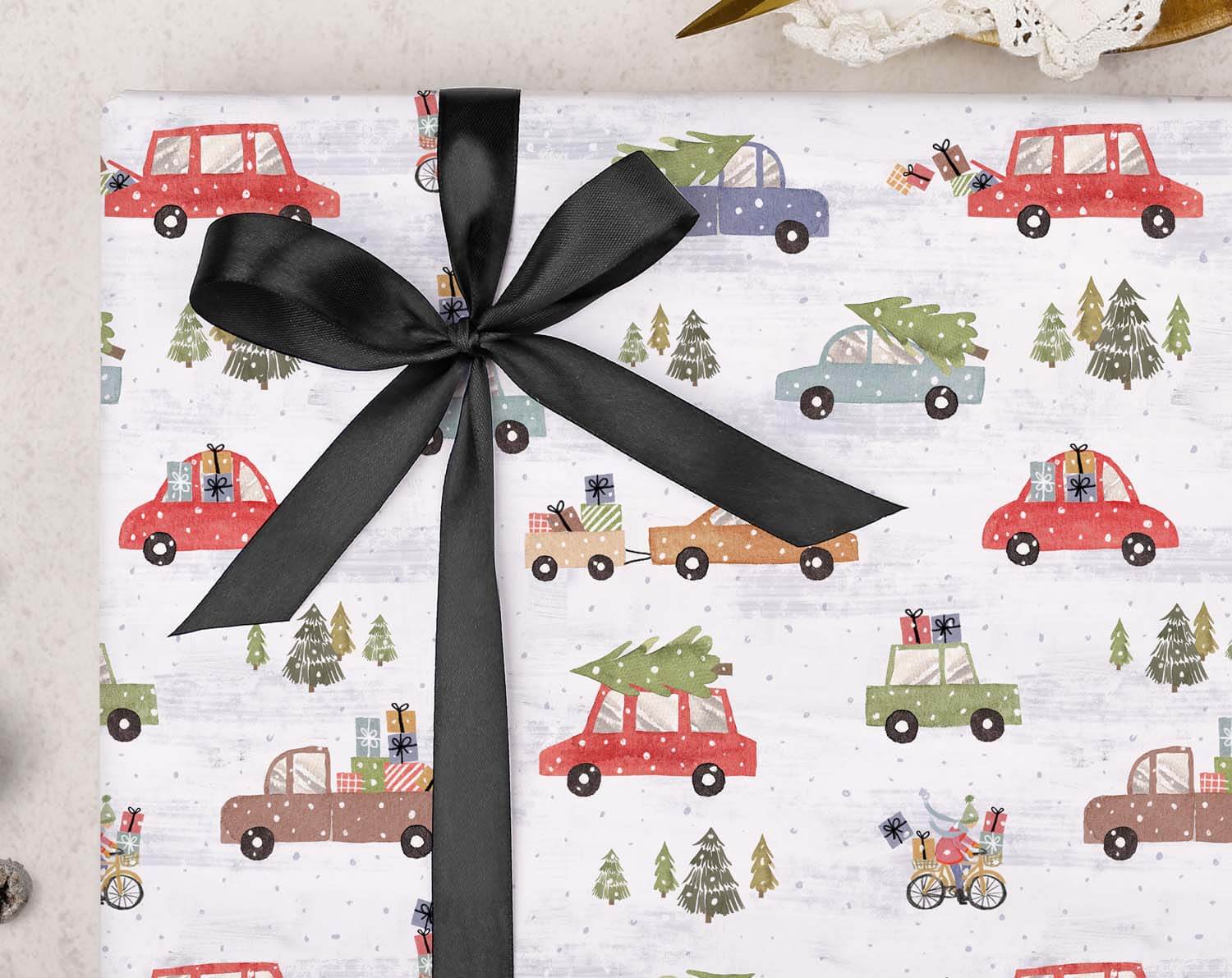 Driving Home Christmas Wrapping Paper featuring vintage cars with Christmas trees and gifts, tied with a black ribbon.