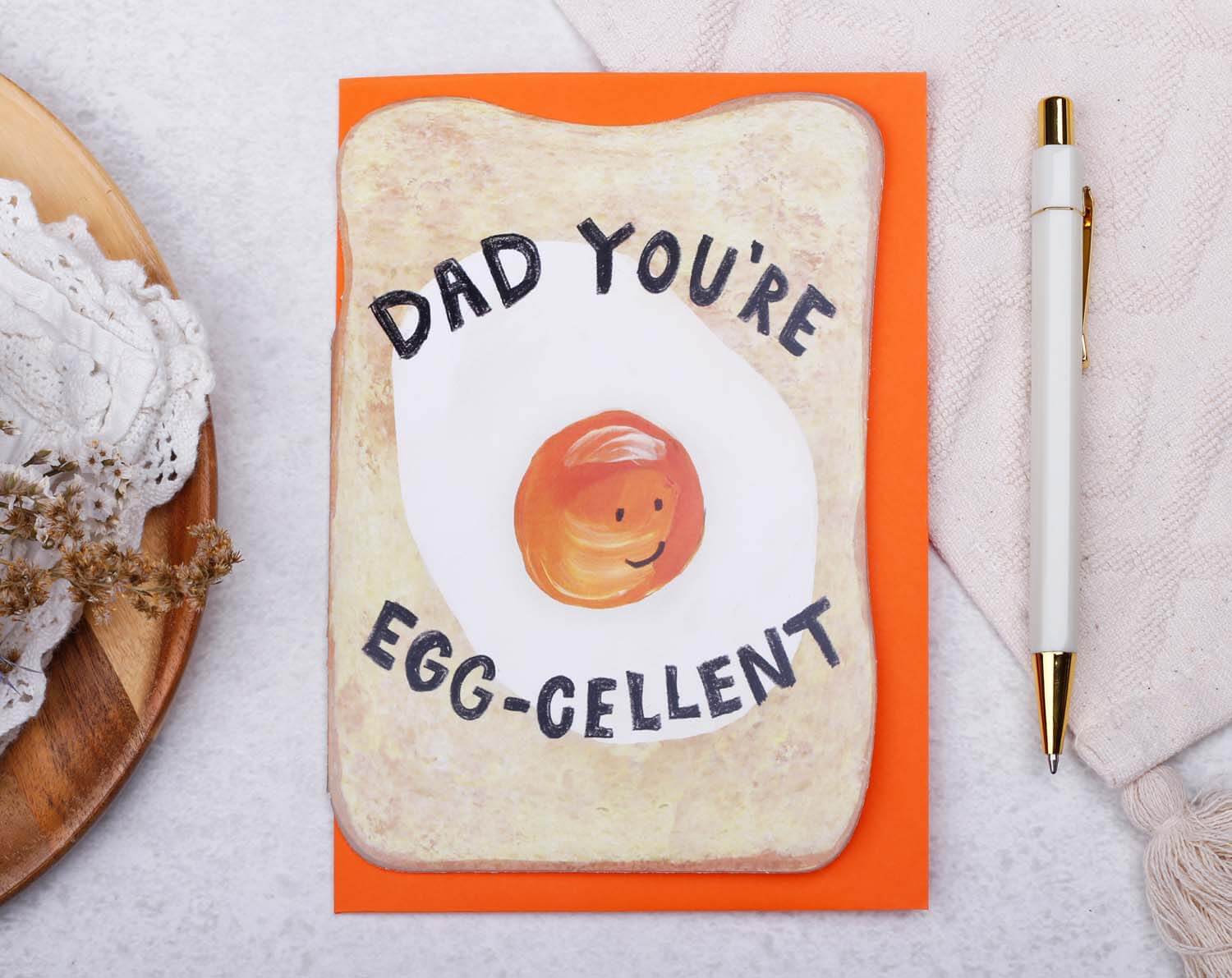 Egg Funny Father's Day Card featuring a playful fried egg design with the text "DAD YOU'RE EGG-CELLENT".