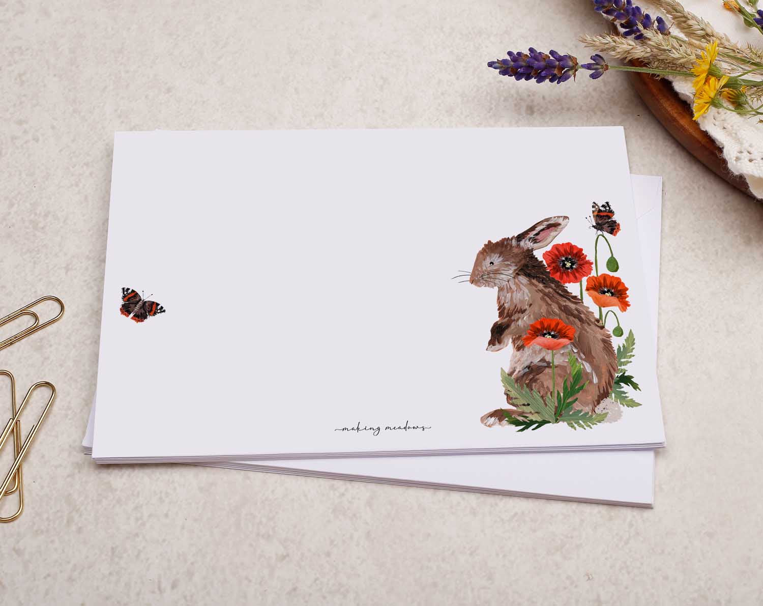 A pretty decorated C6 white envelope with a Bunny Rabbit With Poppy Flower Design.