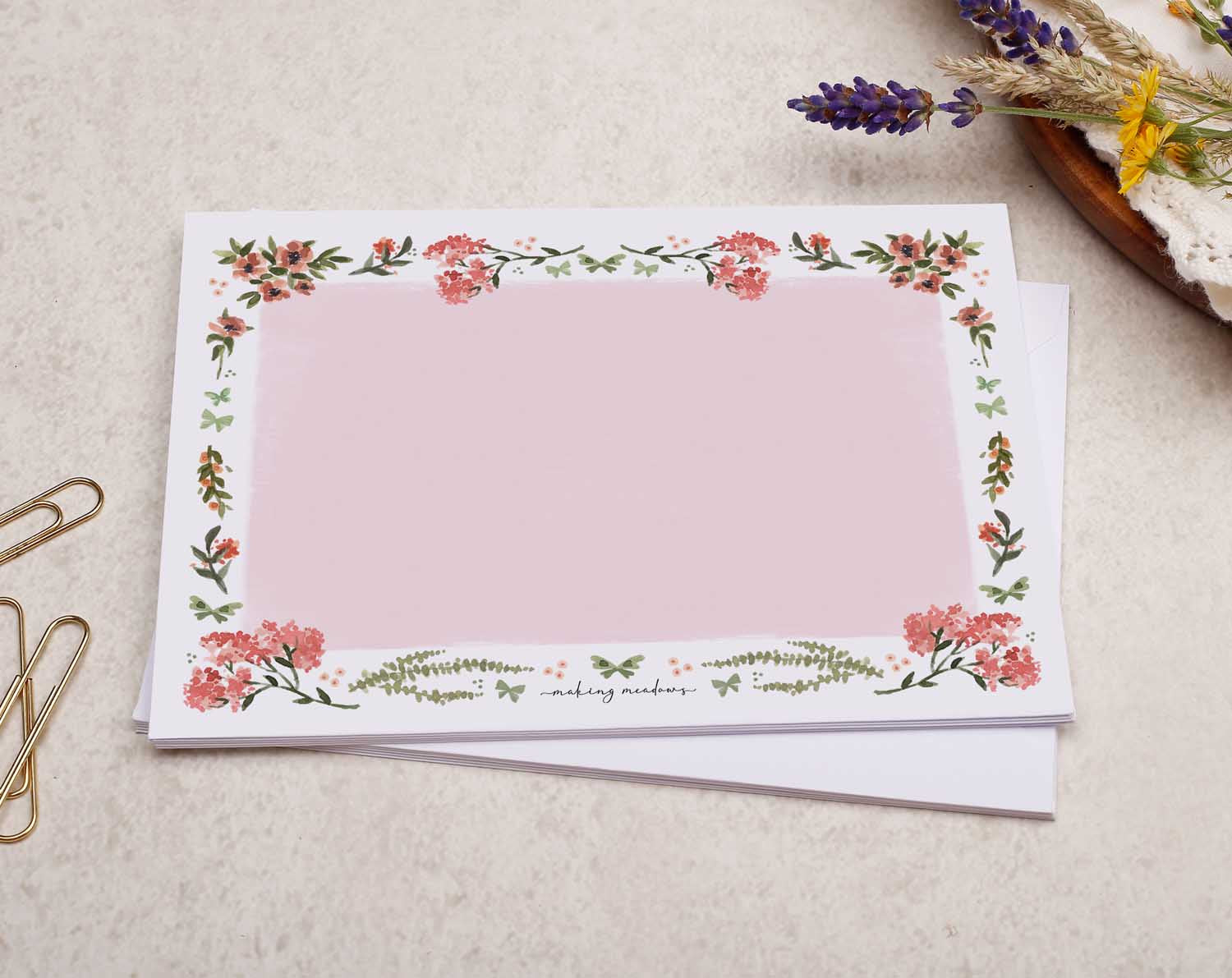 A pretty decorated C6 white envelope with a Watercolour Pink Flower Border Design.