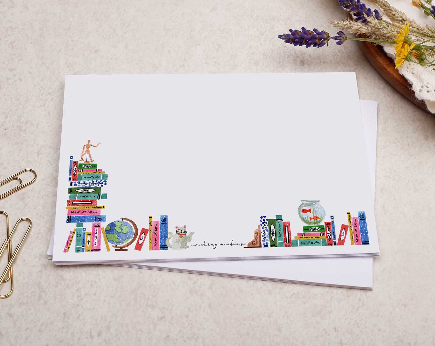 A pretty decorated C6 white envelope with a Cute Bookcase, Book Worm Design. 