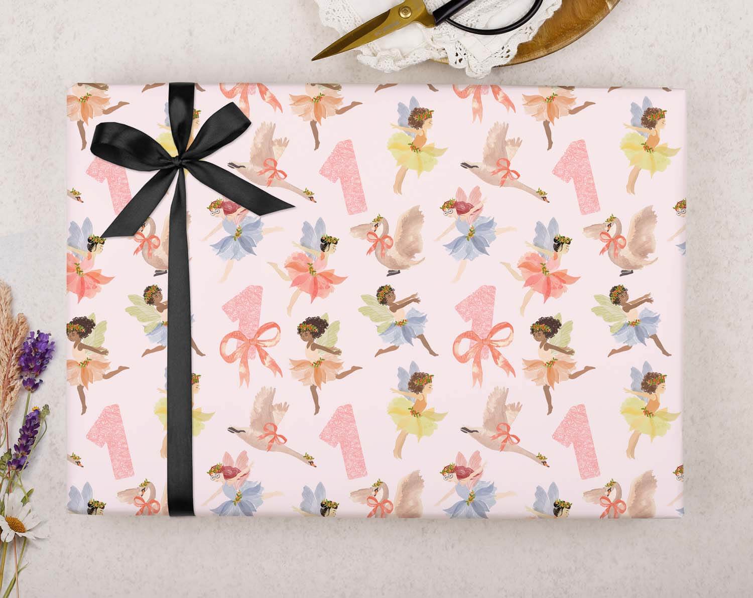 Fairy 1st Birthday Wrapping Paper designed with pink fairies, gifts, and ribbons, perfect for a little girl's birthday.