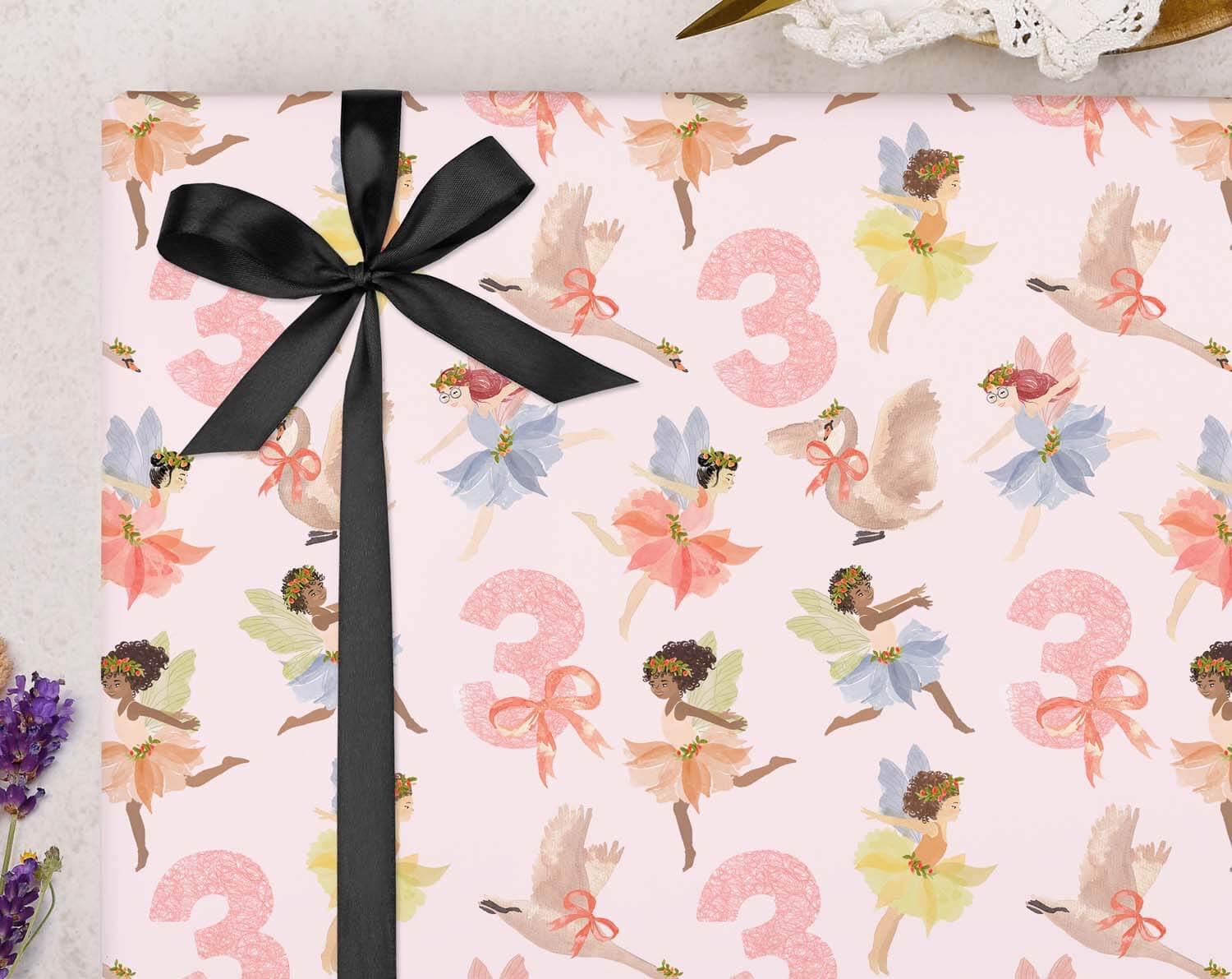 Fairy 3rd Birthday Wrapping Paper with a pink fairy pattern and black ribbon for magical gift wrapping.