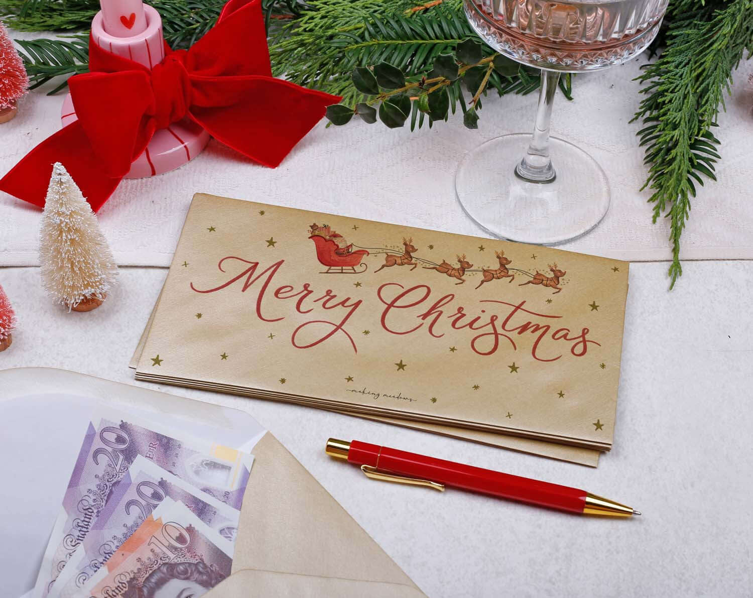Father Christmas Money Envelopes with Merry Christmas design, cash inside, decorative elements for festive gifting.