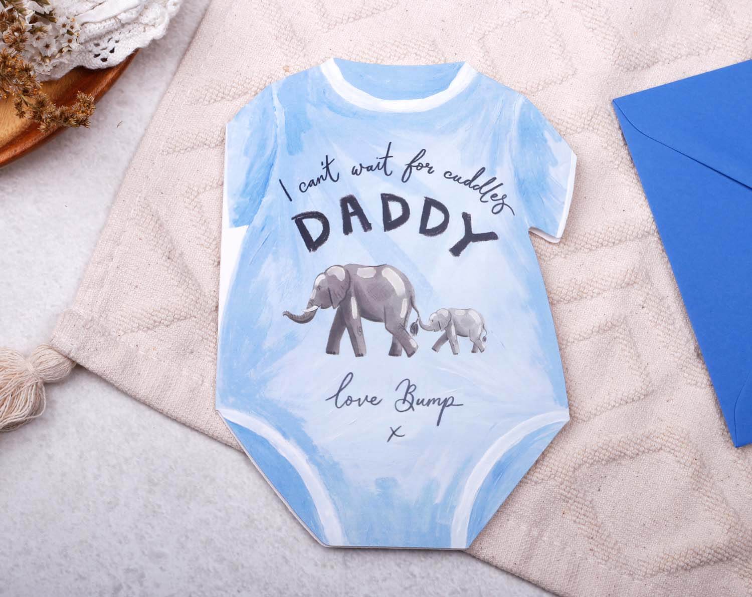 Father's Day From Bump Card designed as a baby grow with elephant illustrations, featuring 'I can't wait for cuddles, Daddy'.