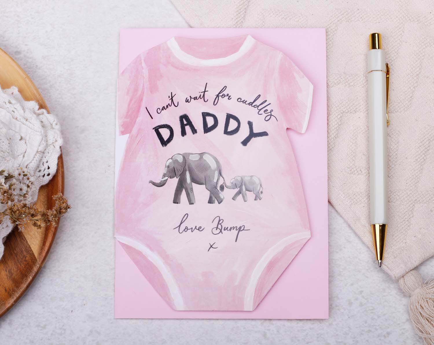 Father's Day From Bump Card featuring a pink baby grow shaped card with elephants for new daddies.