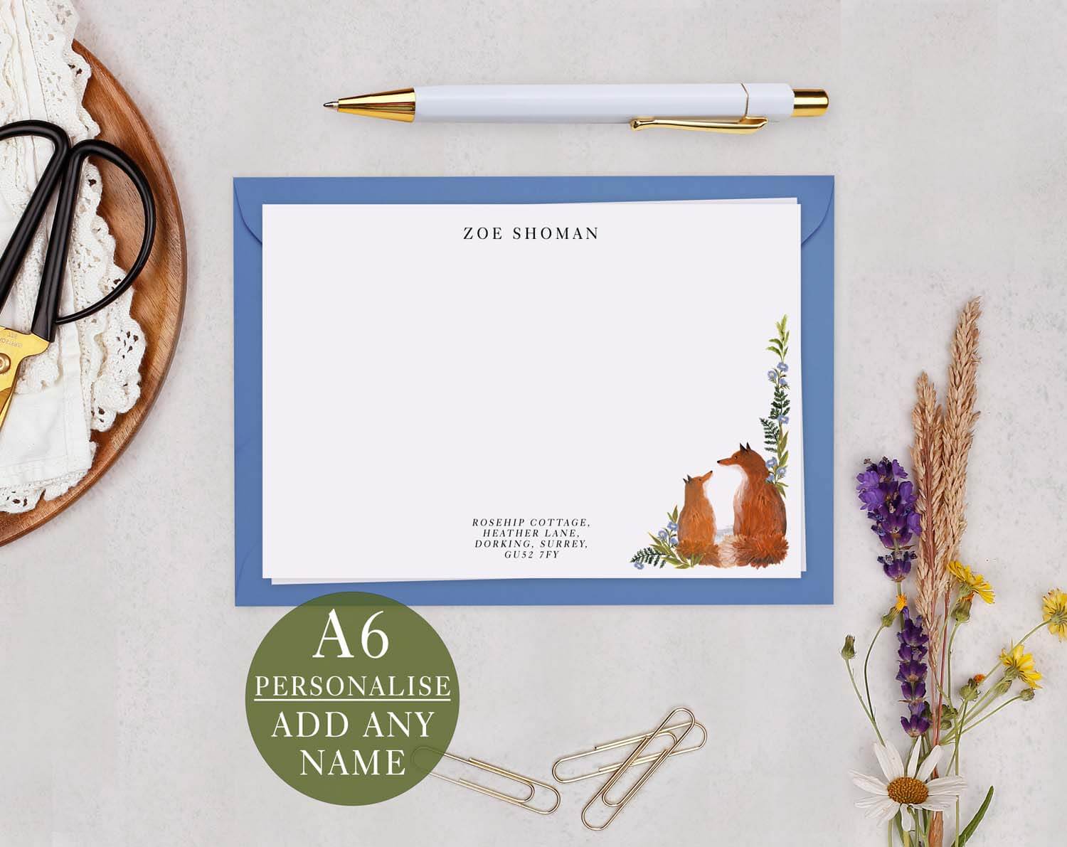Fox Personalised Note cards featuring illustrated foxes and botanical details on a note card with a blue envelope.