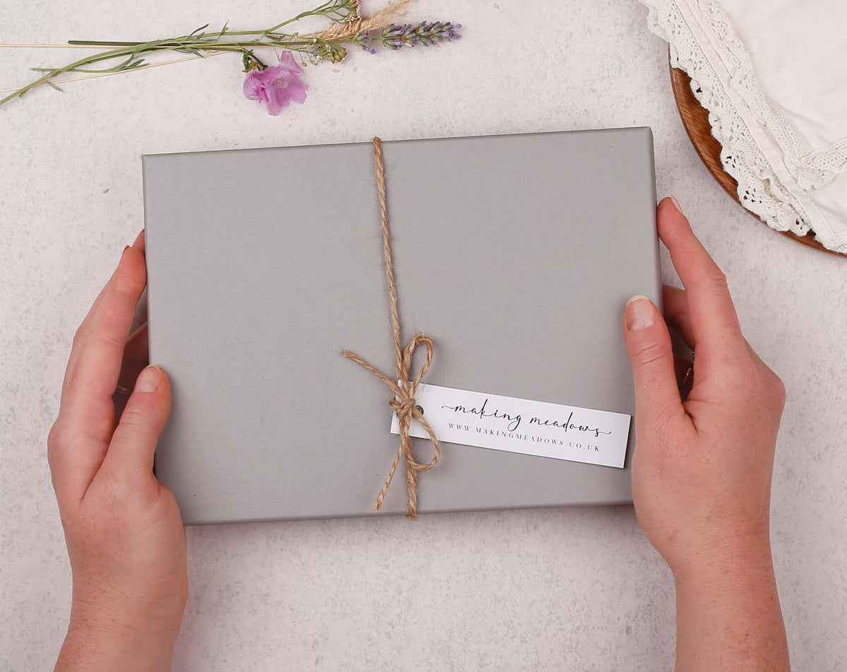 Personalised Children's Stationery Set packaged in a grey box with twine and a tag, perfect gift for kids.