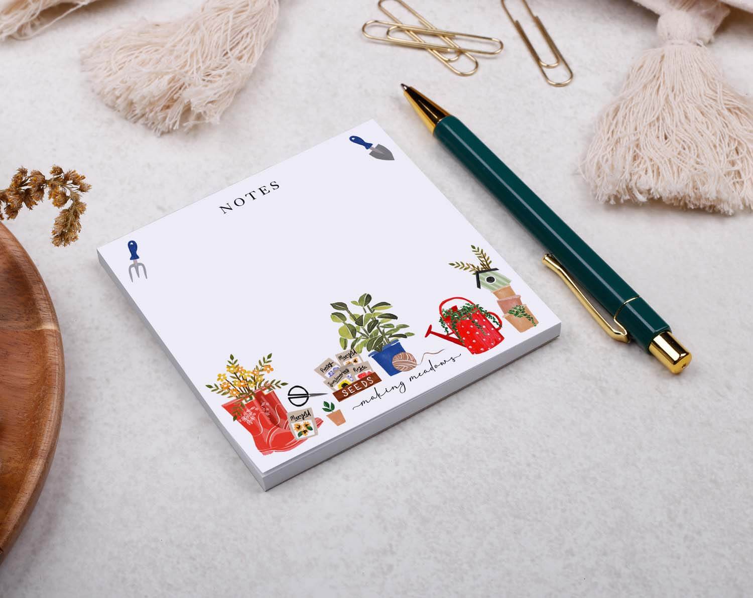 Gardening Memo Pad Block with charming garden illustrations and a stylish pen on a tabletop.