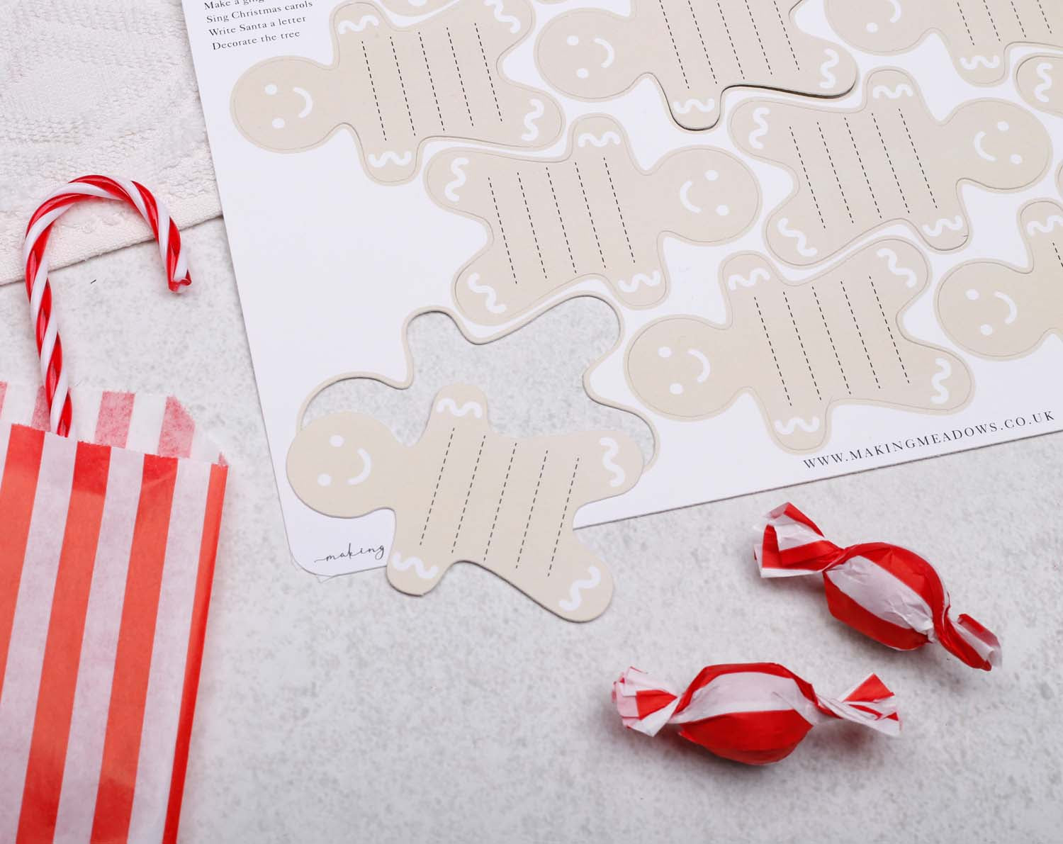 Gingerbread Fill Your Own Activity Cards displayed with striped bag and candies for holiday fun.