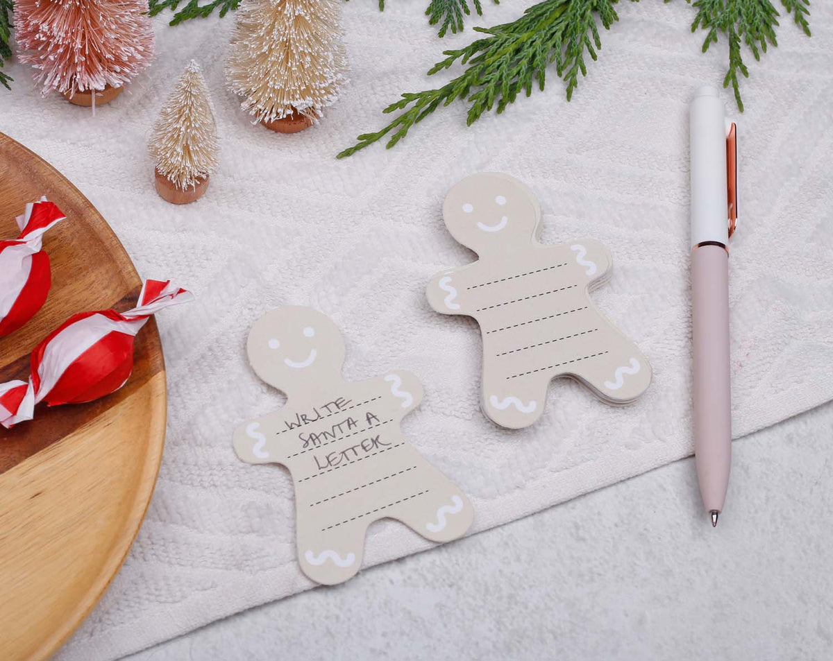 Gingerbread Fill Your Own Activity Cards in festive setting with gingerbread shapes and a pen.