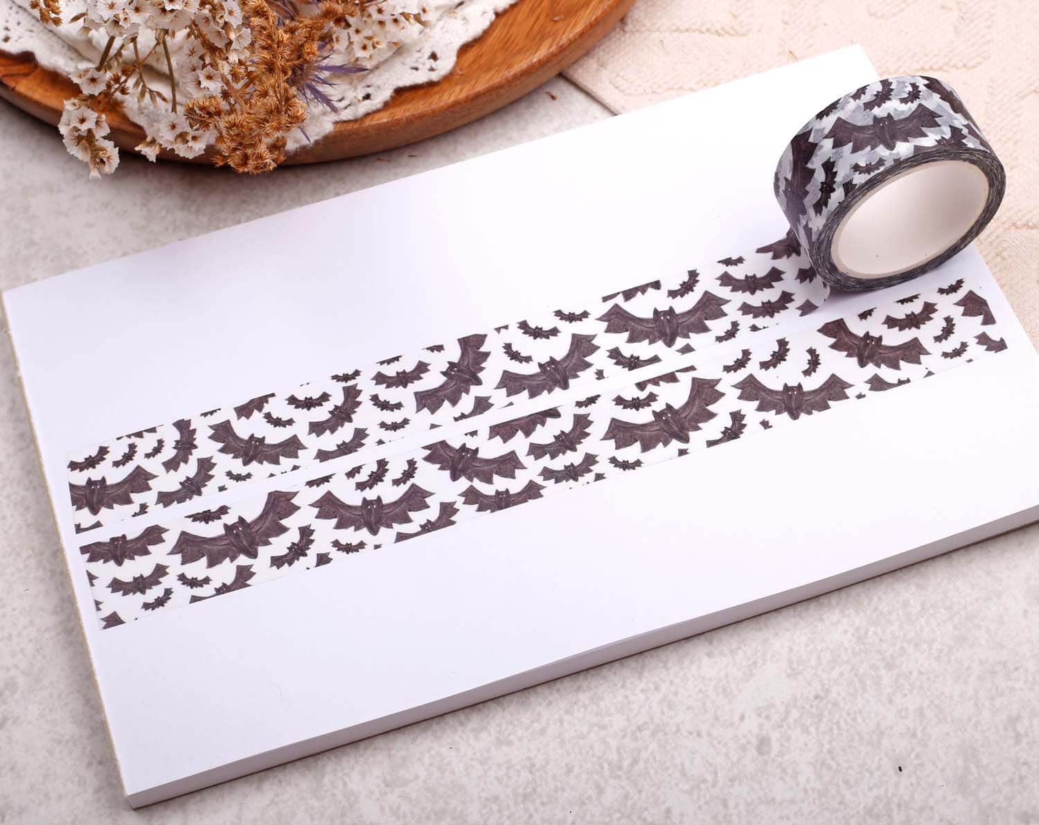 Gothic Bat Washi Tape displayed on a blank paper sheet, showcasing its bat design for crafts and journaling.