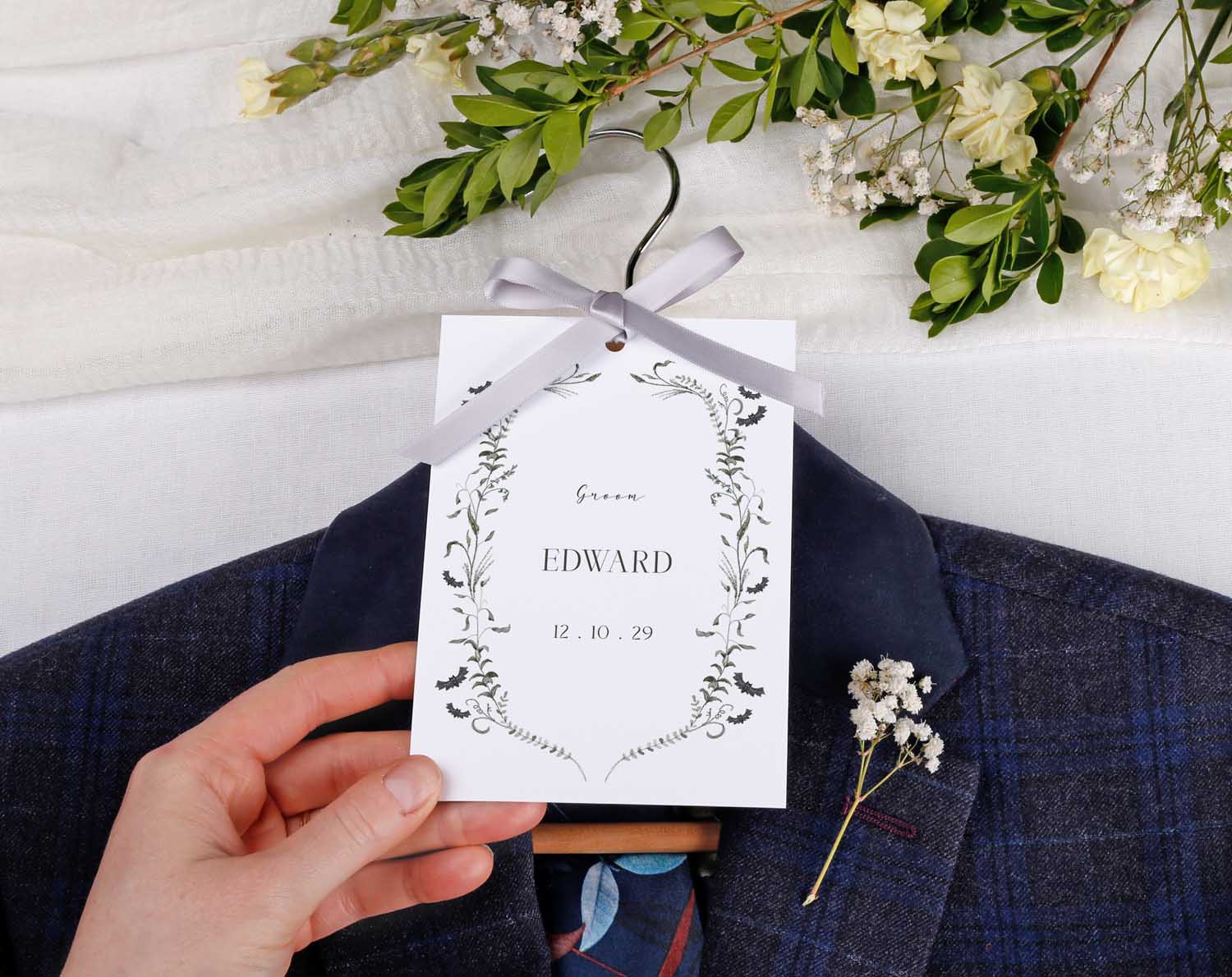 Gothic Wedding Hanger Tags featuring personalized name 'EDWARD' for bridal party outfits, surrounded by flowers.