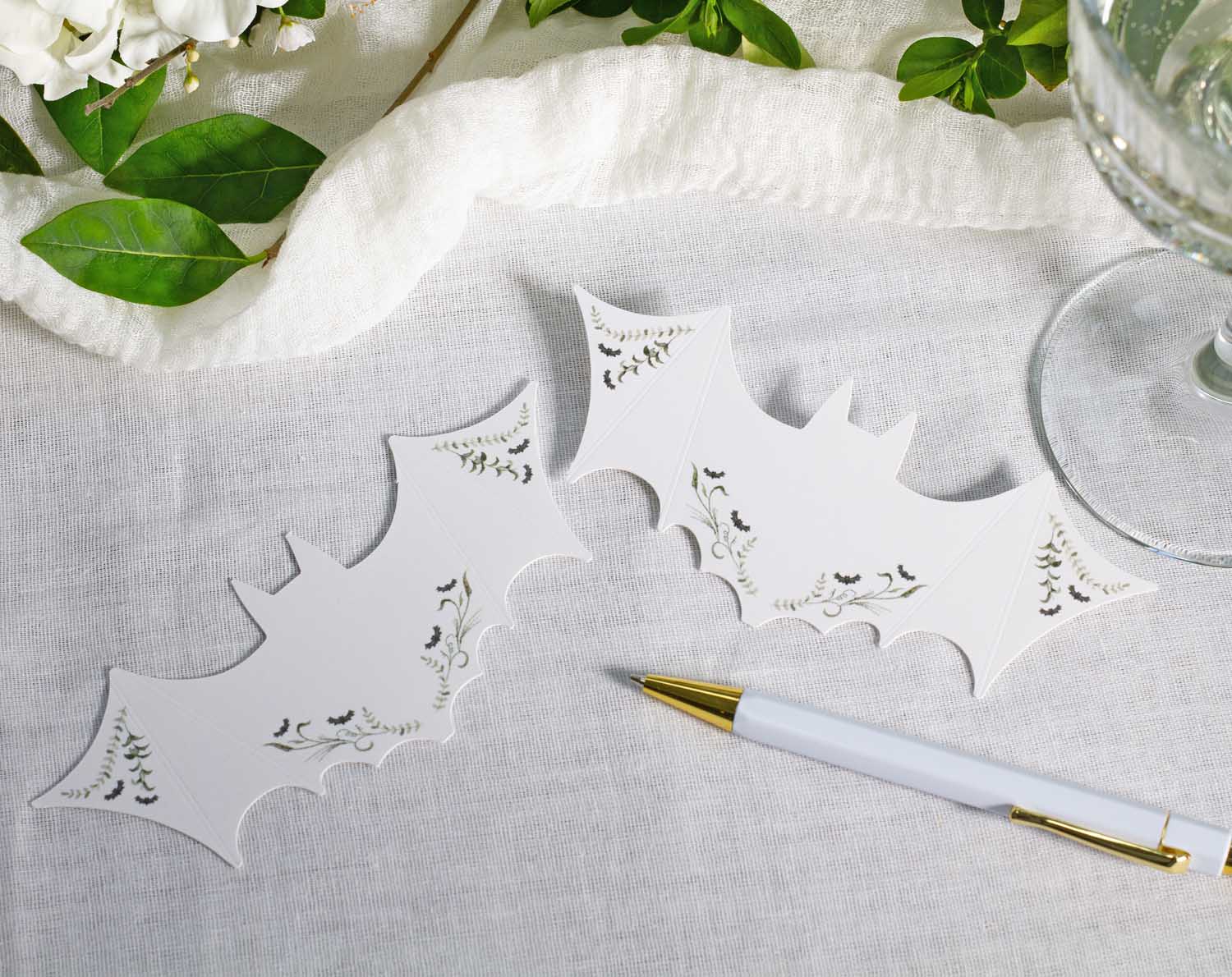 Gothic Wedding Place Cards featuring bat shape design on white background, perfect for unique wedding table settings.