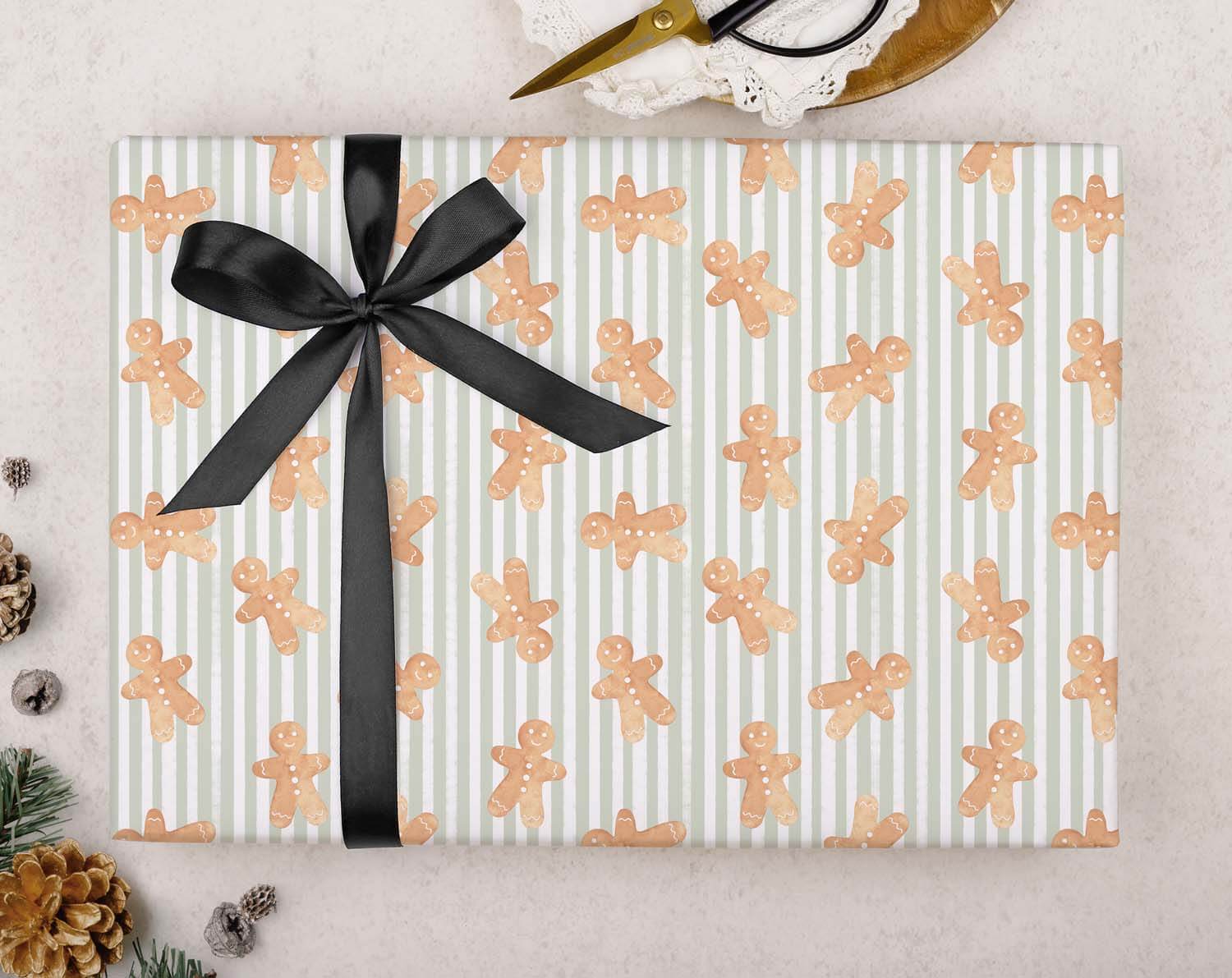 Green Gingerbread Christmas Wrapping Paper featuring gingerbread patterns and a black ribbon bow.
