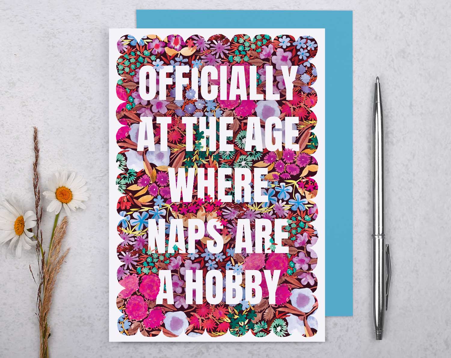 Joke Birthday Card with 'Naps Are a Hobby' featuring colorful floral design and humorous text.