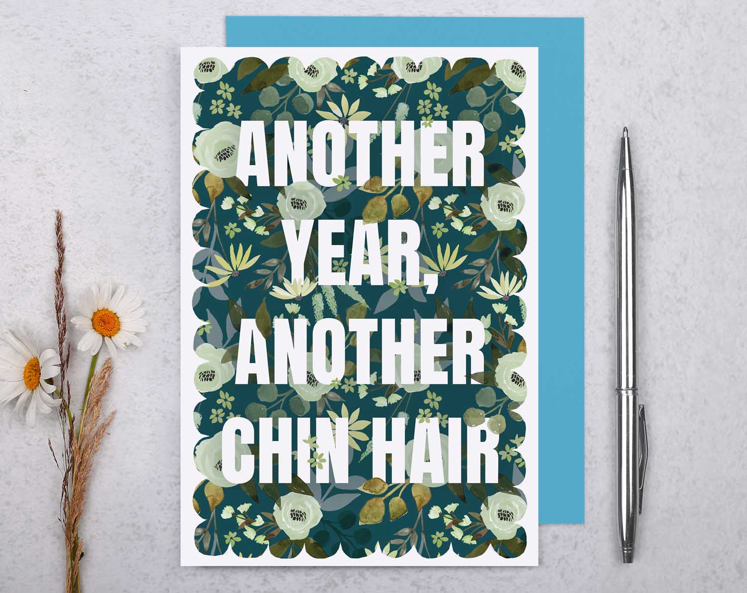 Joke Birthday Card featuring bold text "Another Year, Another Chin Hair" on a floral background.