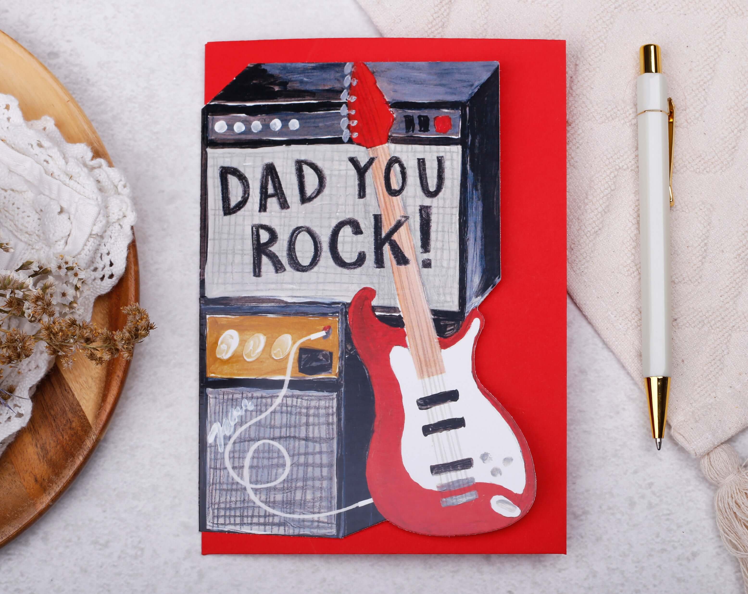 Rock Guitar Father's Day Card featuring a guitar and amplifier with the text 'DAD YOU ROCK!'
