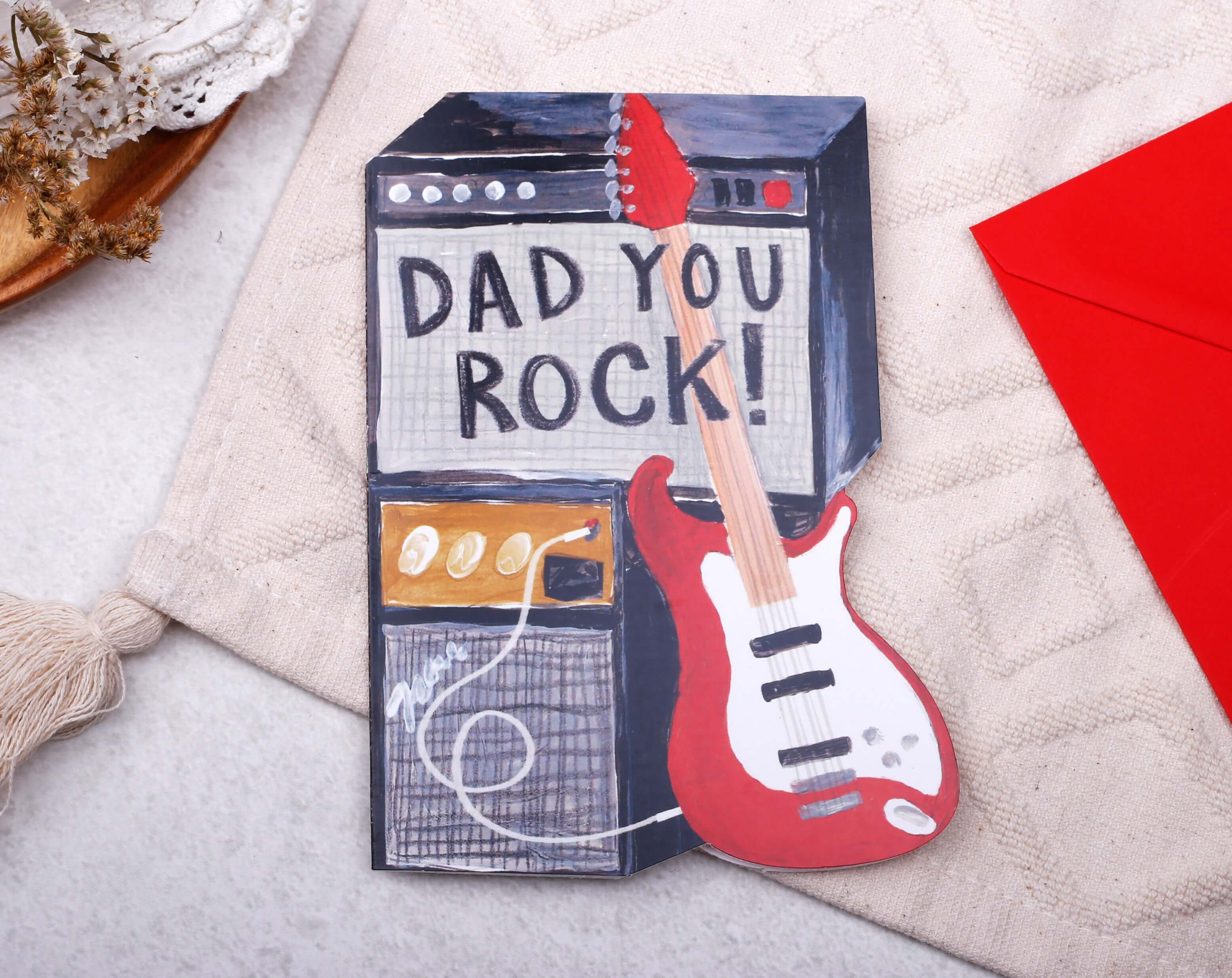 Rock Guitar Father's Day Card featuring a guitar and amplifier with the text 'DAD YOU ROCK!'