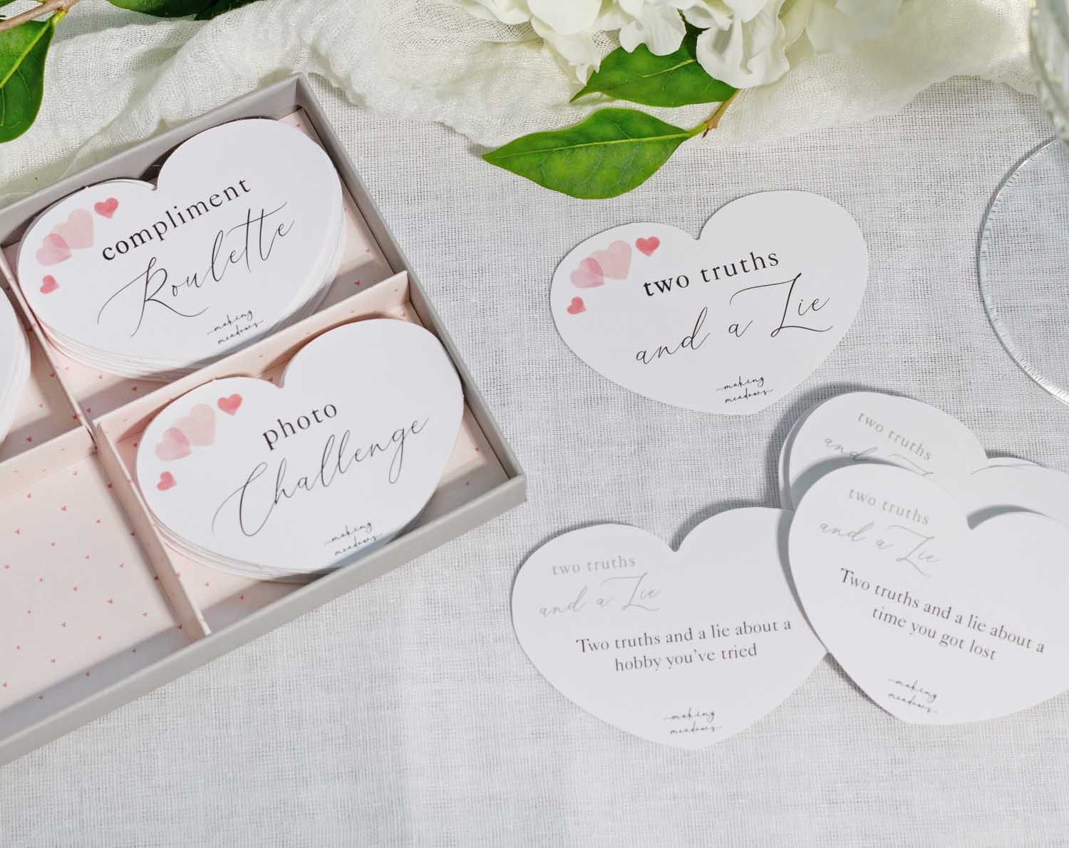 Heart Wedding Table Game featuring mini games like Compliment Roulette and Two Truths and a Lie.