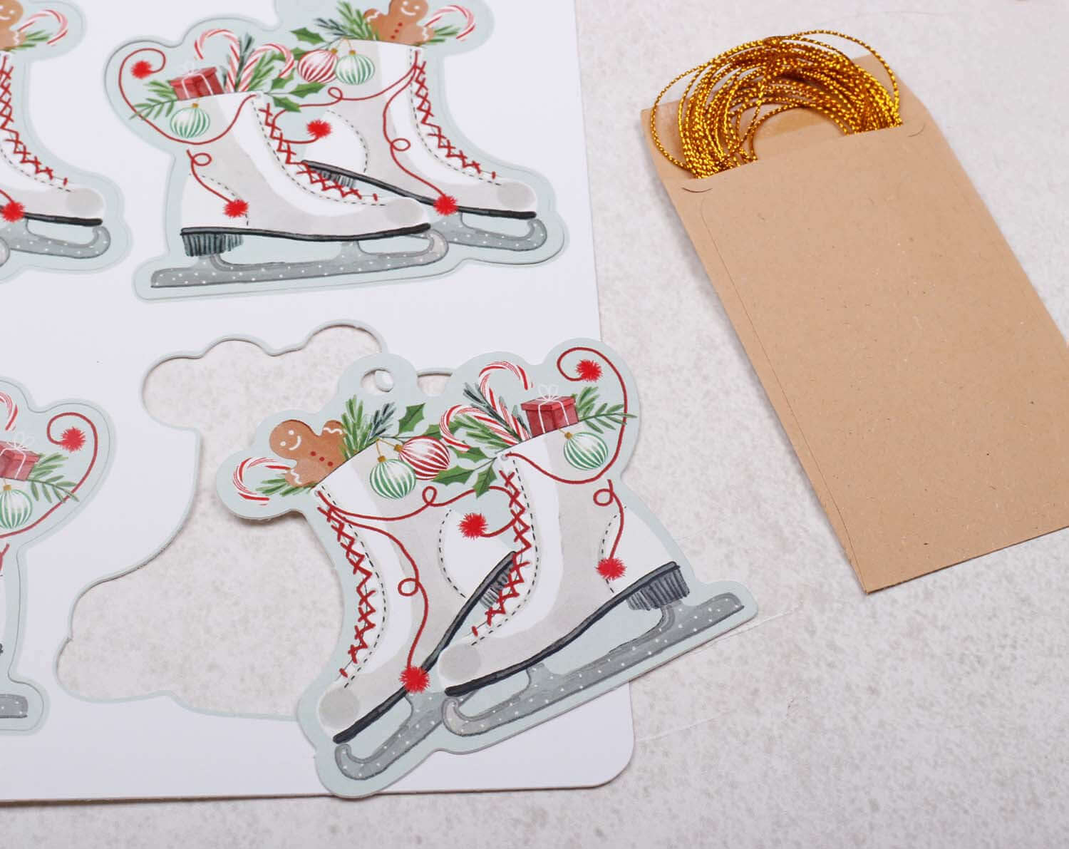 Ice Skating Christmas Gift Tags featuring vintage skater illustrations and gold twine for elegant holiday wrapping.