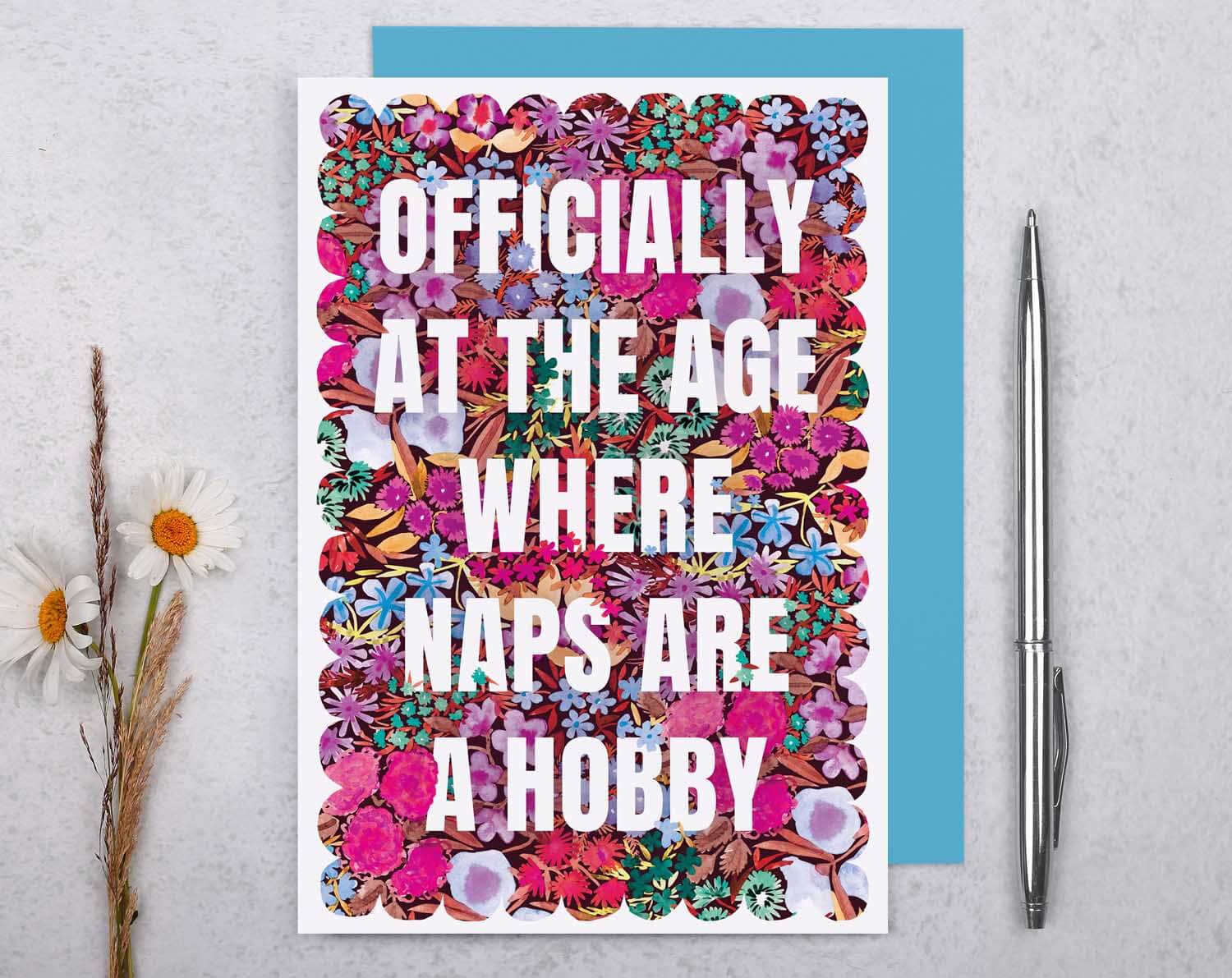 Joke Birthday Card with 'Naps Are a Hobby' featuring colorful floral design and humorous text.