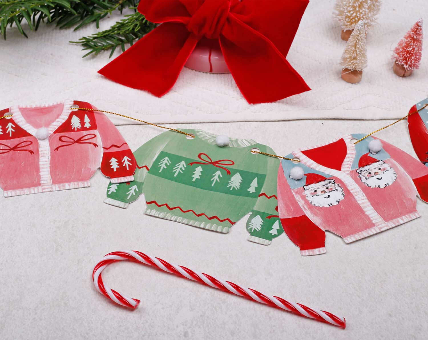 Jumper Christmas Bunting featuring colorful festive jumper flags with holiday designs.